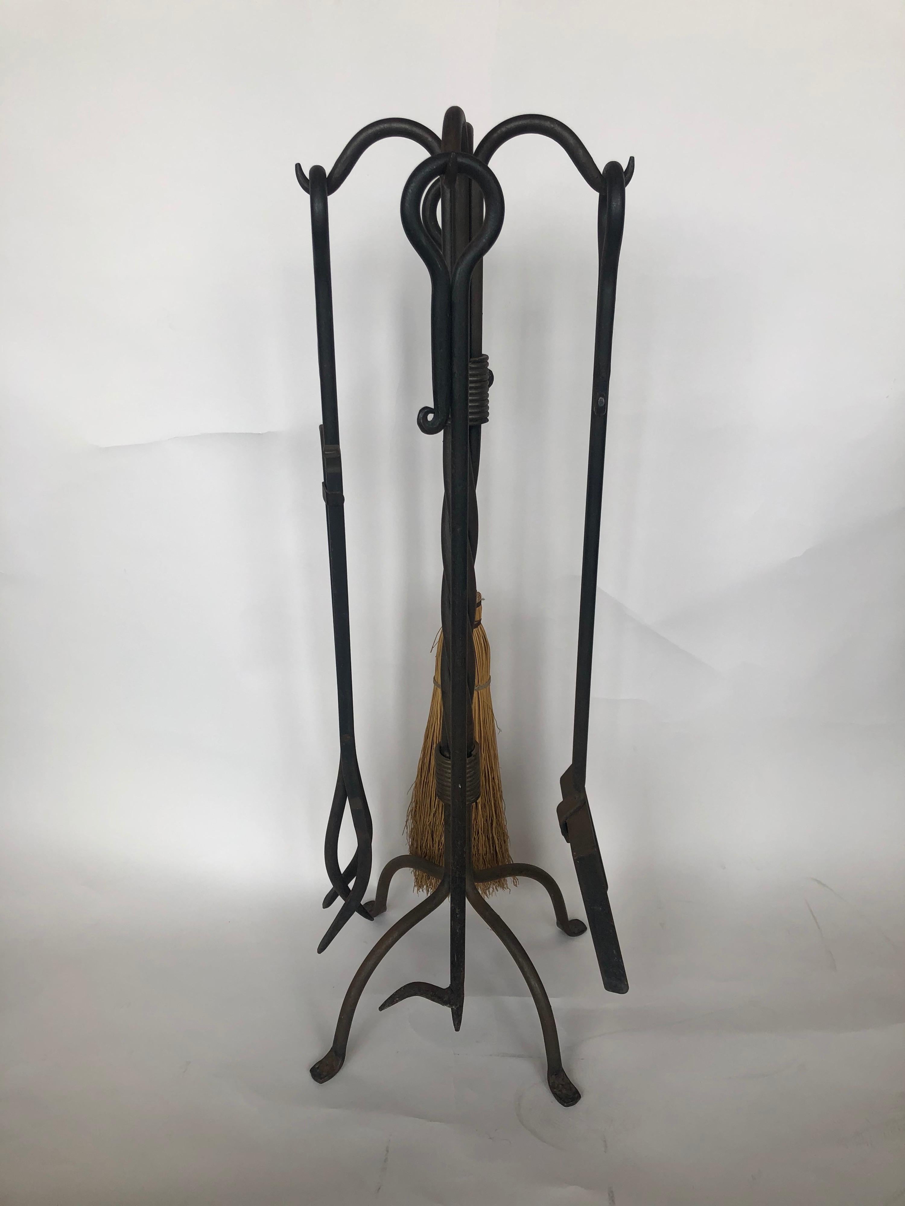 Set of four Spanish wrought iron fire place tools.