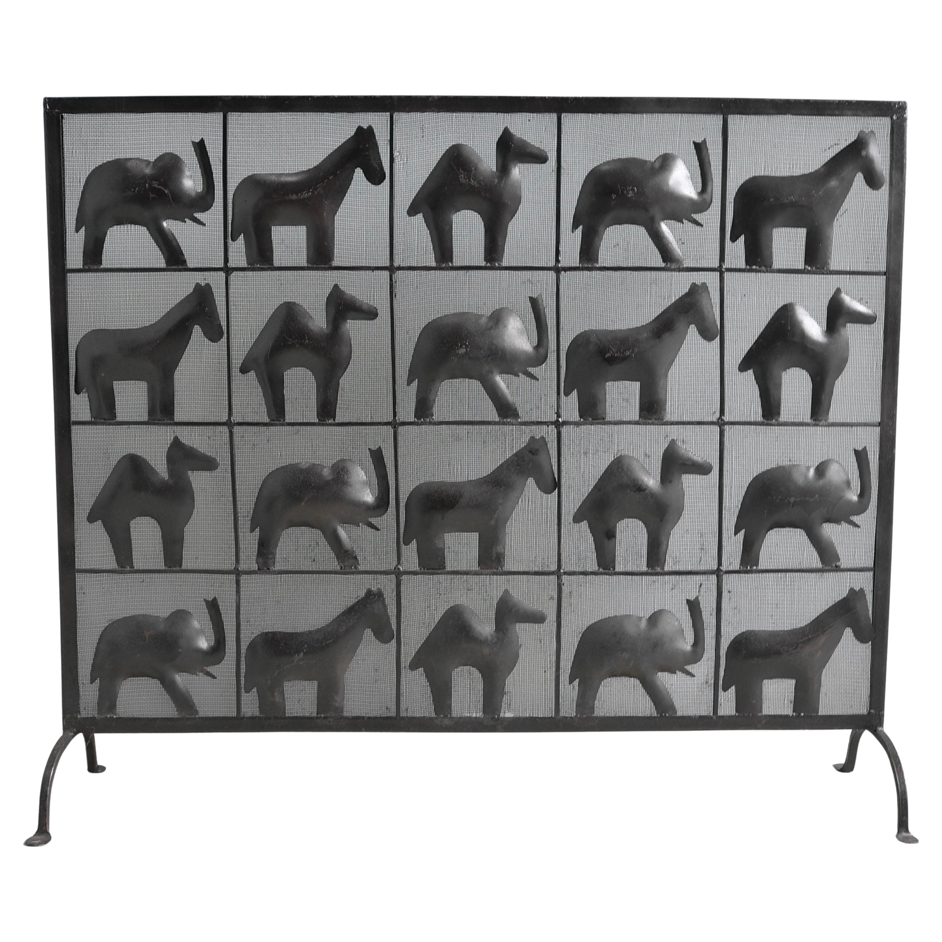 Wrought Iron Fire Screen, African Animals by Atelier Marolles, France, 1955. Very decorative and useful piece with dense mesh against the sparks.


