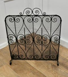 Wrought Iron Fire Screen  This is an intricate and very attractive piece, the wr