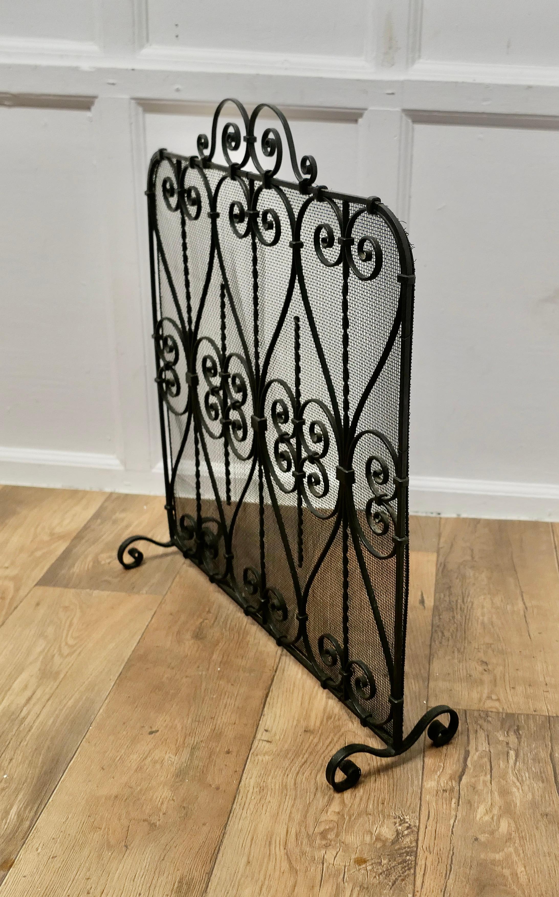 Mid-20th Century Wrought Iron Fire Screen  This is an intricate and very attractive piece, the wr For Sale