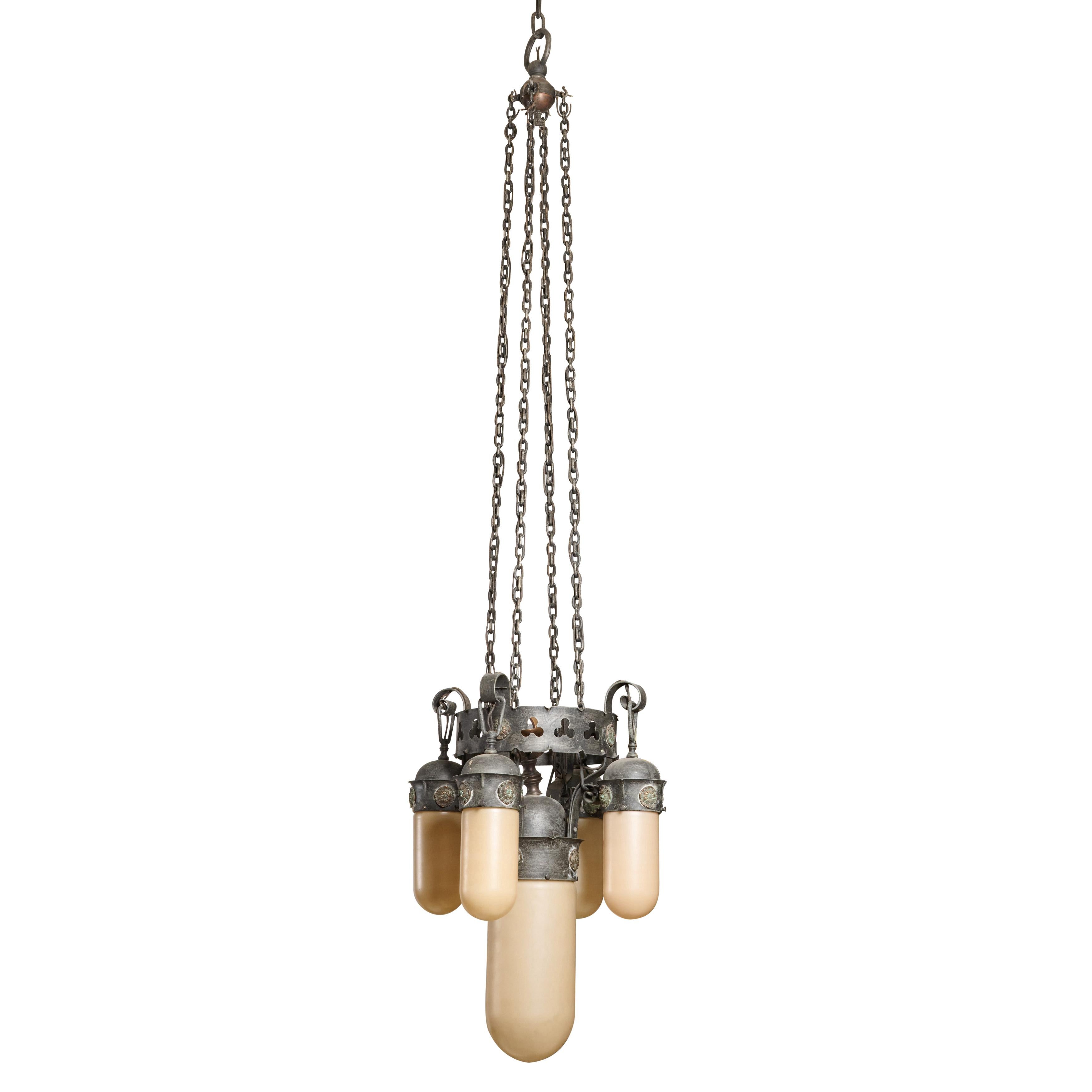 Fantastic wrought iron five light chandelier with great shades. Length of drop is adjustable. Excellent quality.