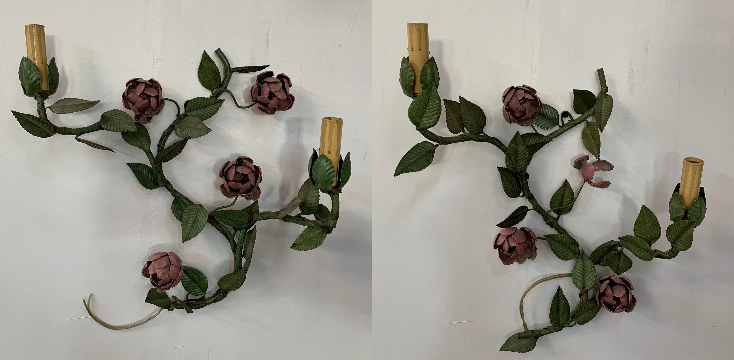 This lovely pair of wrought iron wall sconces each having two candelabras with custom beaded shades is just delightful. Skillfully made in a shape of flowers and leaves in pink and green colors, the wrought iron wall sconces will add a touch of