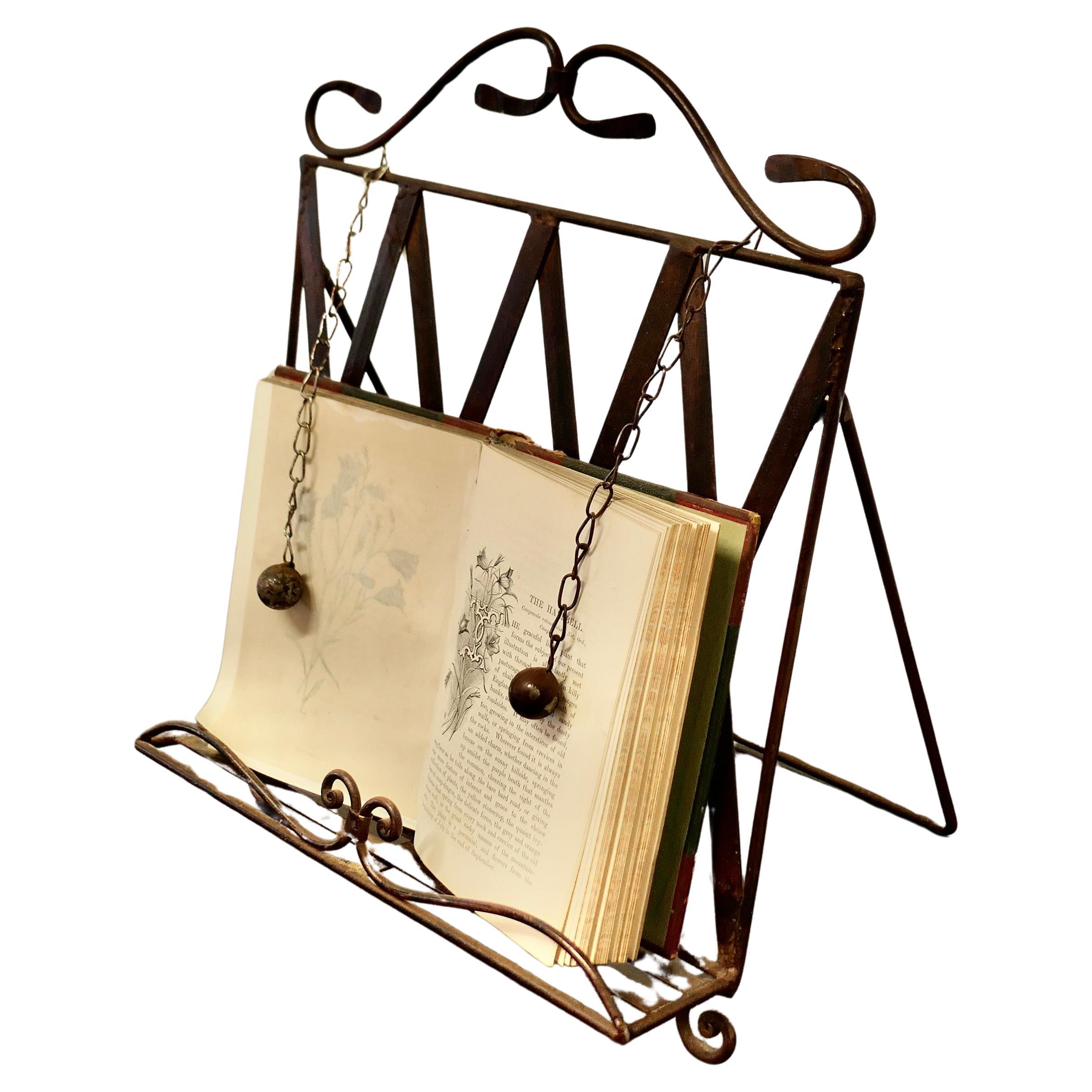 Wrought Iron Folding Book Rest, with Page Weights  This is a charming piece  For Sale