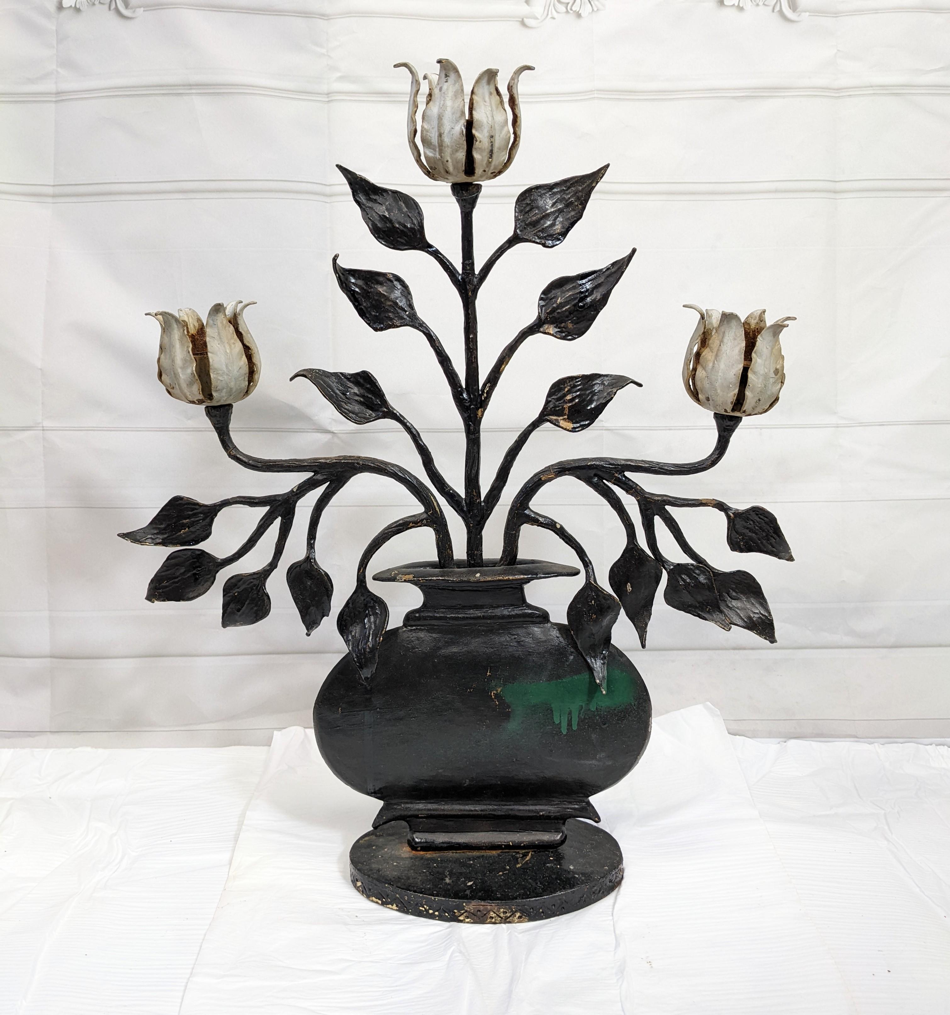 Charming hand wrought iron Folk Art Tulip Candleabra from the 1930's. Heavy enough to use as doorstop as well. Beautifully rendered. 1930's USA.
Measures: Height 20