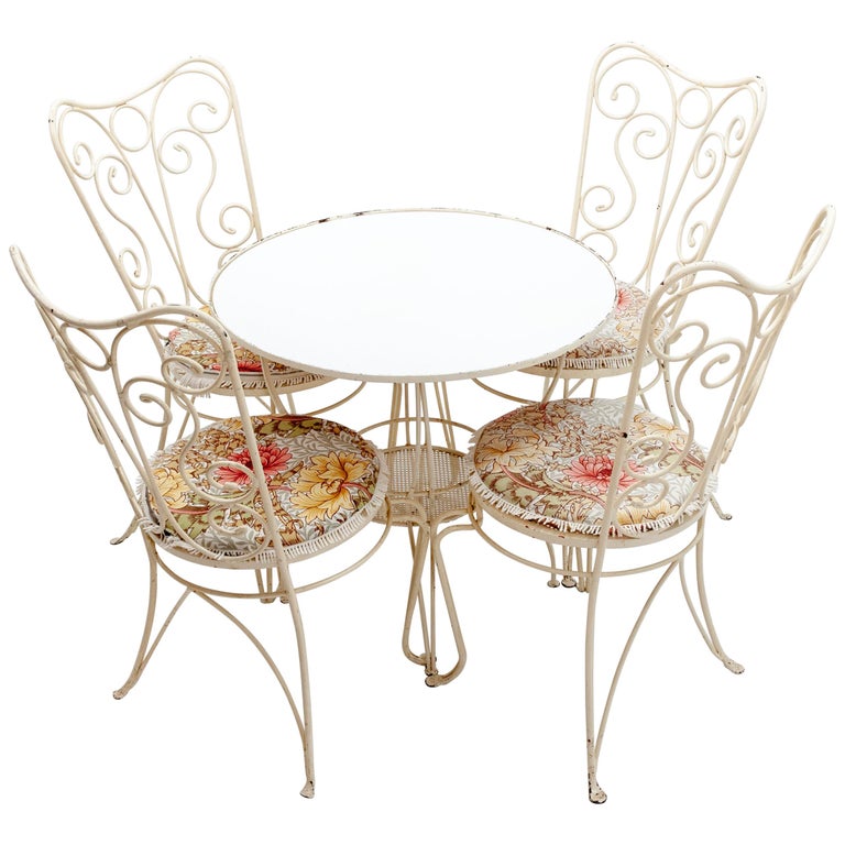 View of Wrought Iron French Garden Set of Four Chairs and a Table, 1950s at 1stDibs