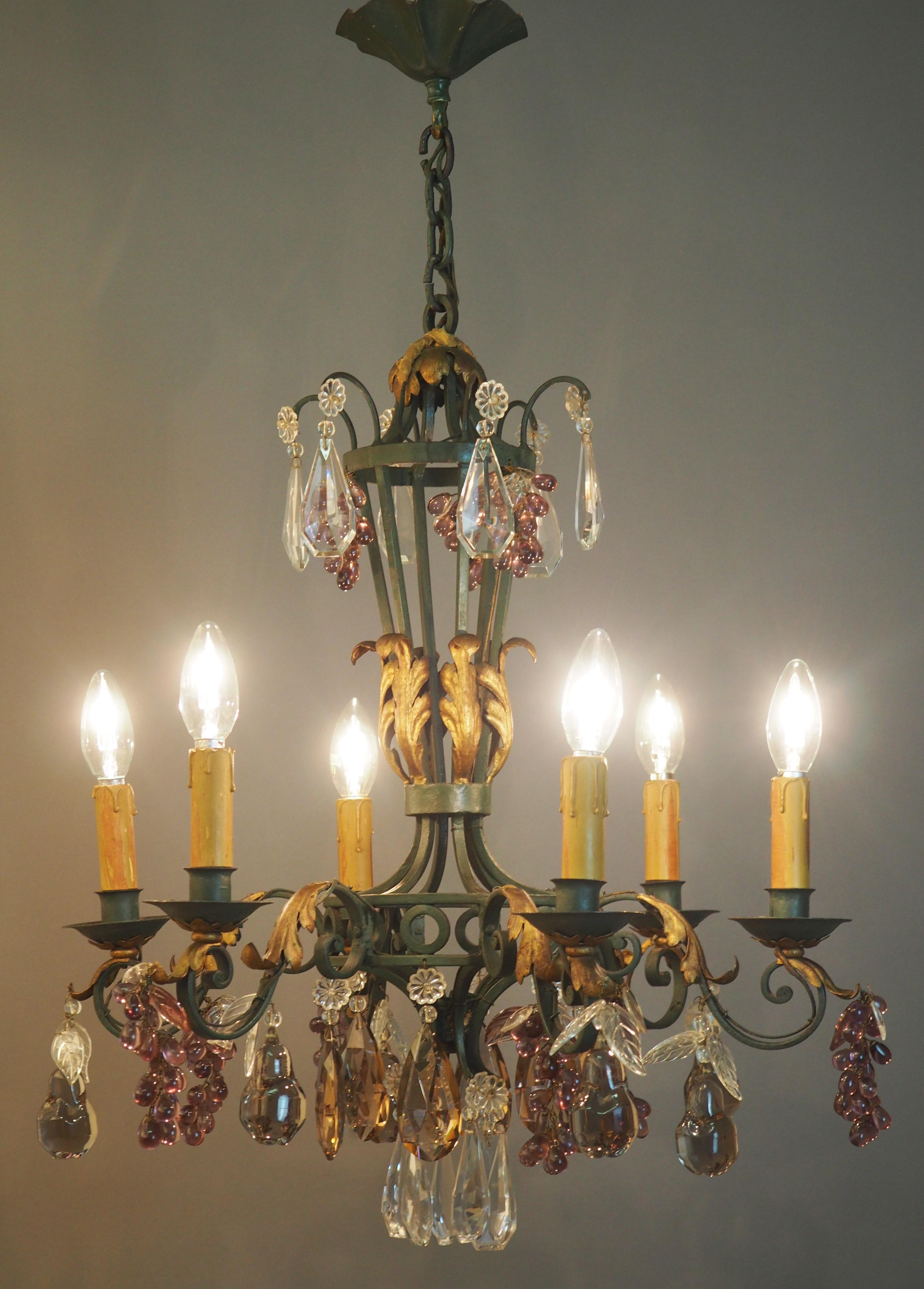 A wonderful, green patinated and gilt wrought iron six-light chandelier decorated with glass pears, leaves greaps and crystal pendants, France, circa 1900-1920s.
Socket: 6 x e14  standard screw bulbs.

New wiring for US standards on request.
