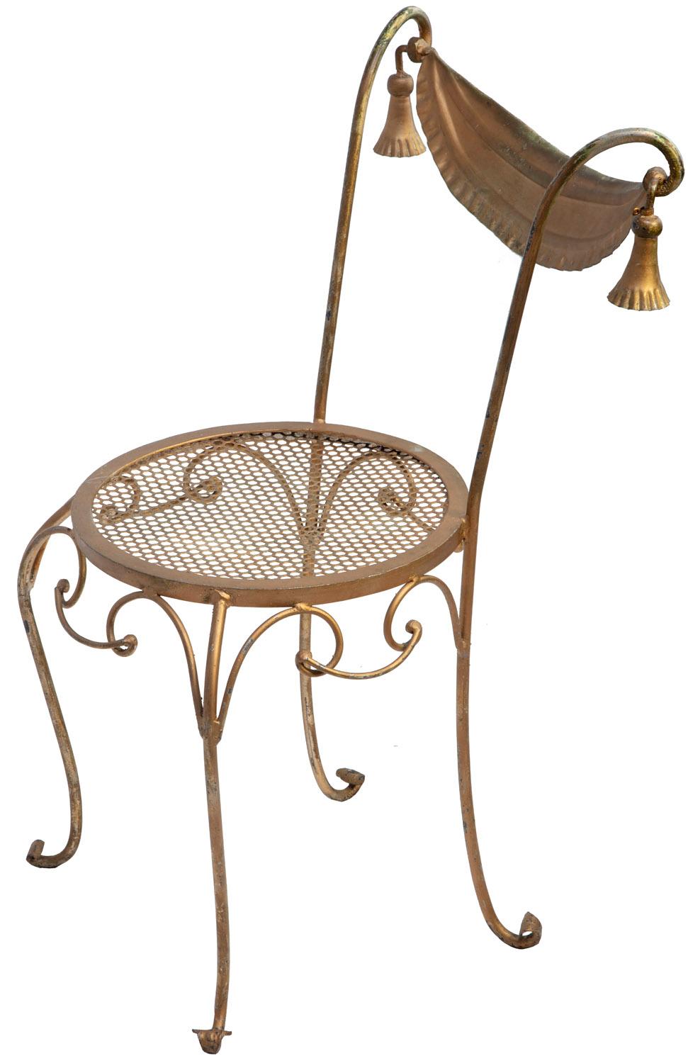 Gold painted wrought iron chair with honeycomb pattern seat and tassels.