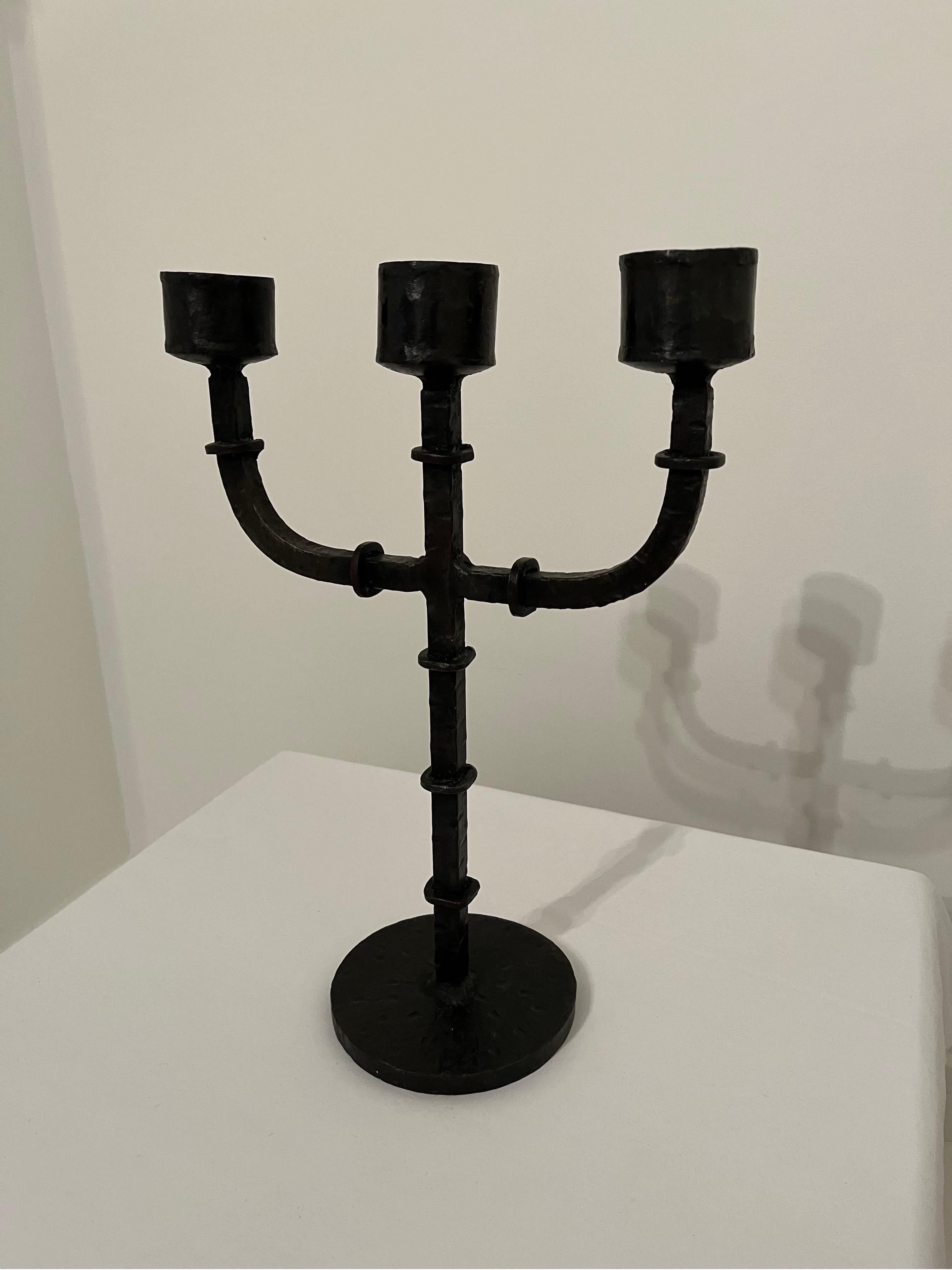 Heavy wrought ironwork candelabra, 3.3kg. 

Nice ring detail with hammered finish to main body. 
