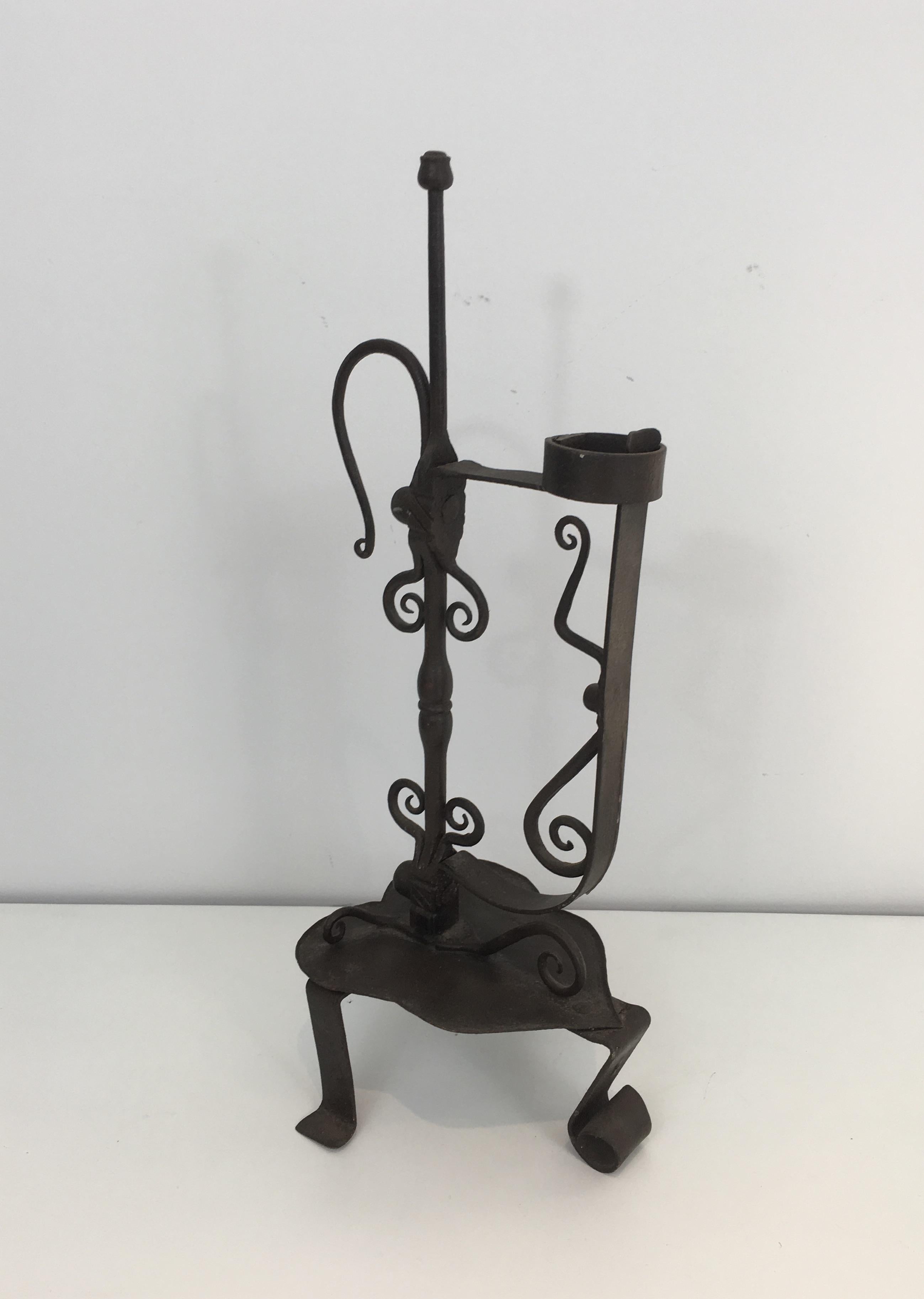 This gothic style candleholder is made of wrought Iron. This is a very nice and fine French work, circa 1920.
