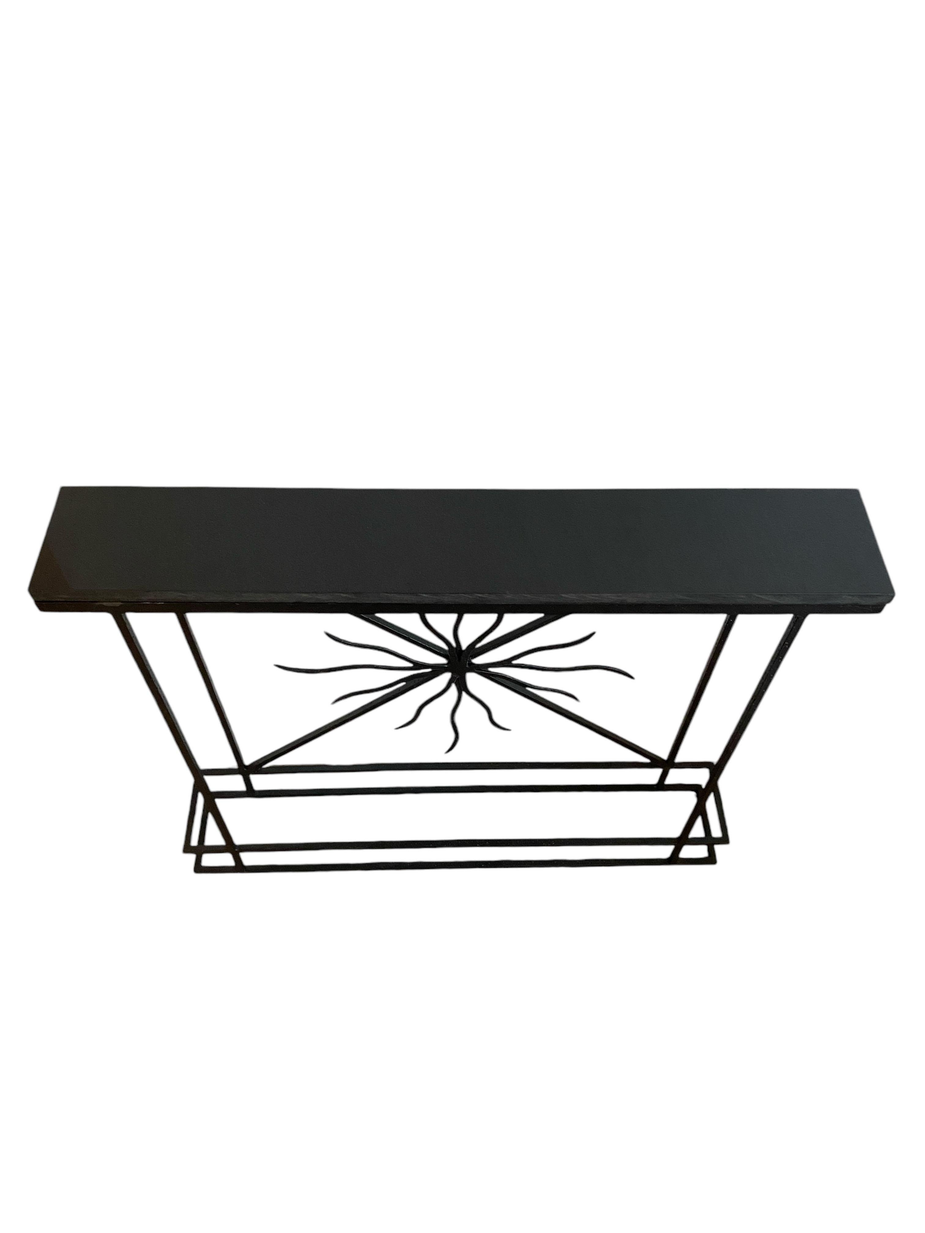 Introducing a stunning Art Deco style narrow console that effortlessly combines elegance and functionality. Featuring a luxurious black honed granite top, this console is not only visually striking but also durable, making it a perfect addition to