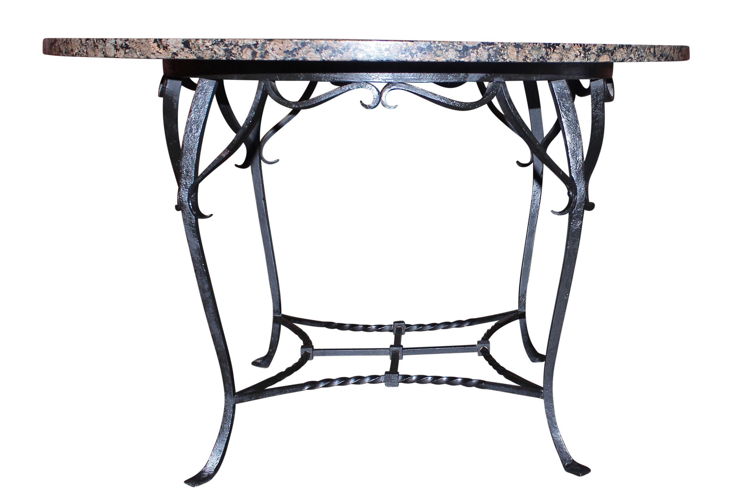 Antique wrought iron and granite dining table. Base is handmade. Table is strong and solidly built. Made circa 1910. Table may be used indoors or outdoors. Please, contact us for shipping options.