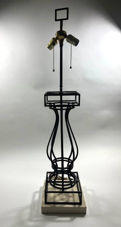 Lampe en fer forgé d'après un modèle de Marc Du Plantier