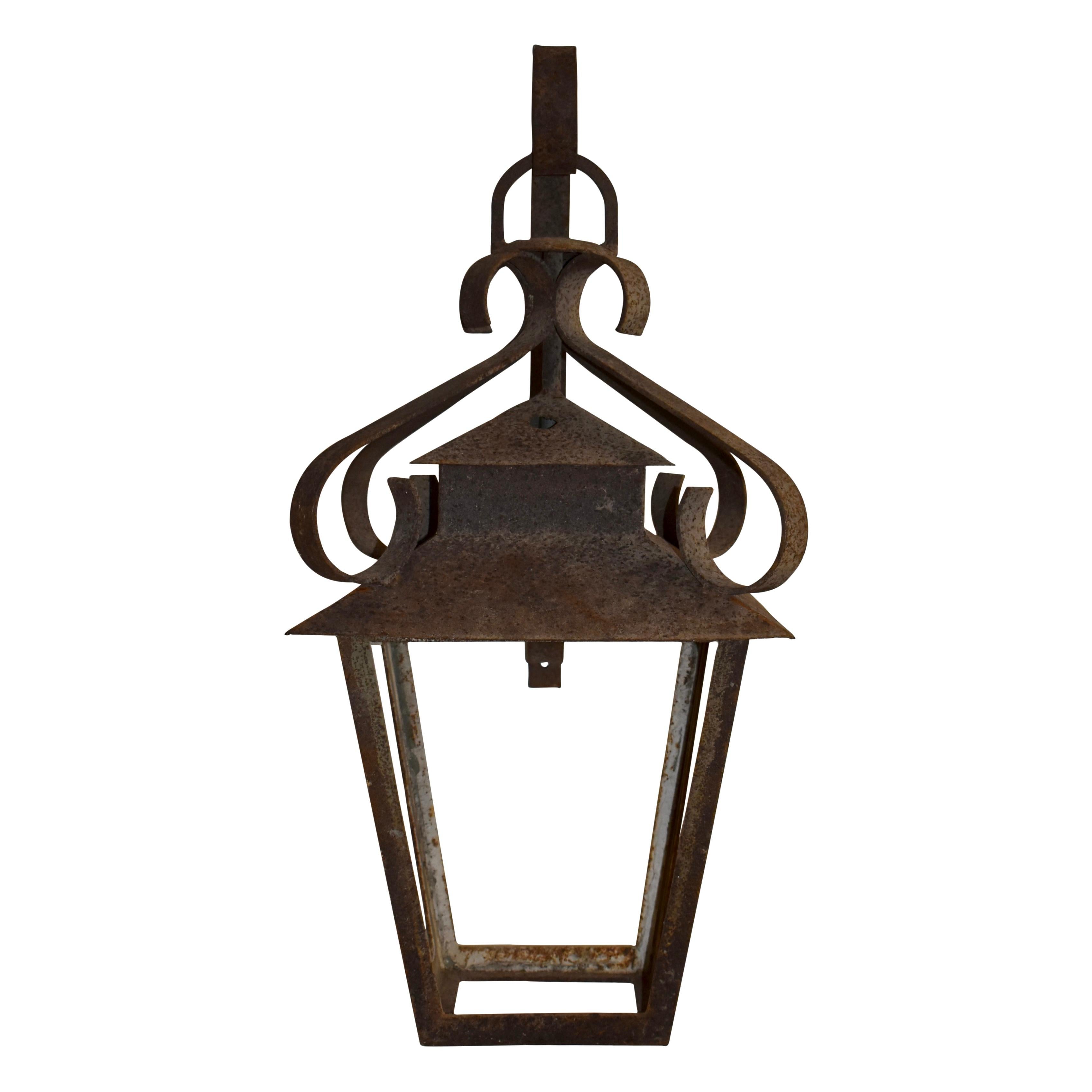 European Wrought Iron Lantern Suspended from Wall Bracket, circa 1900 For Sale