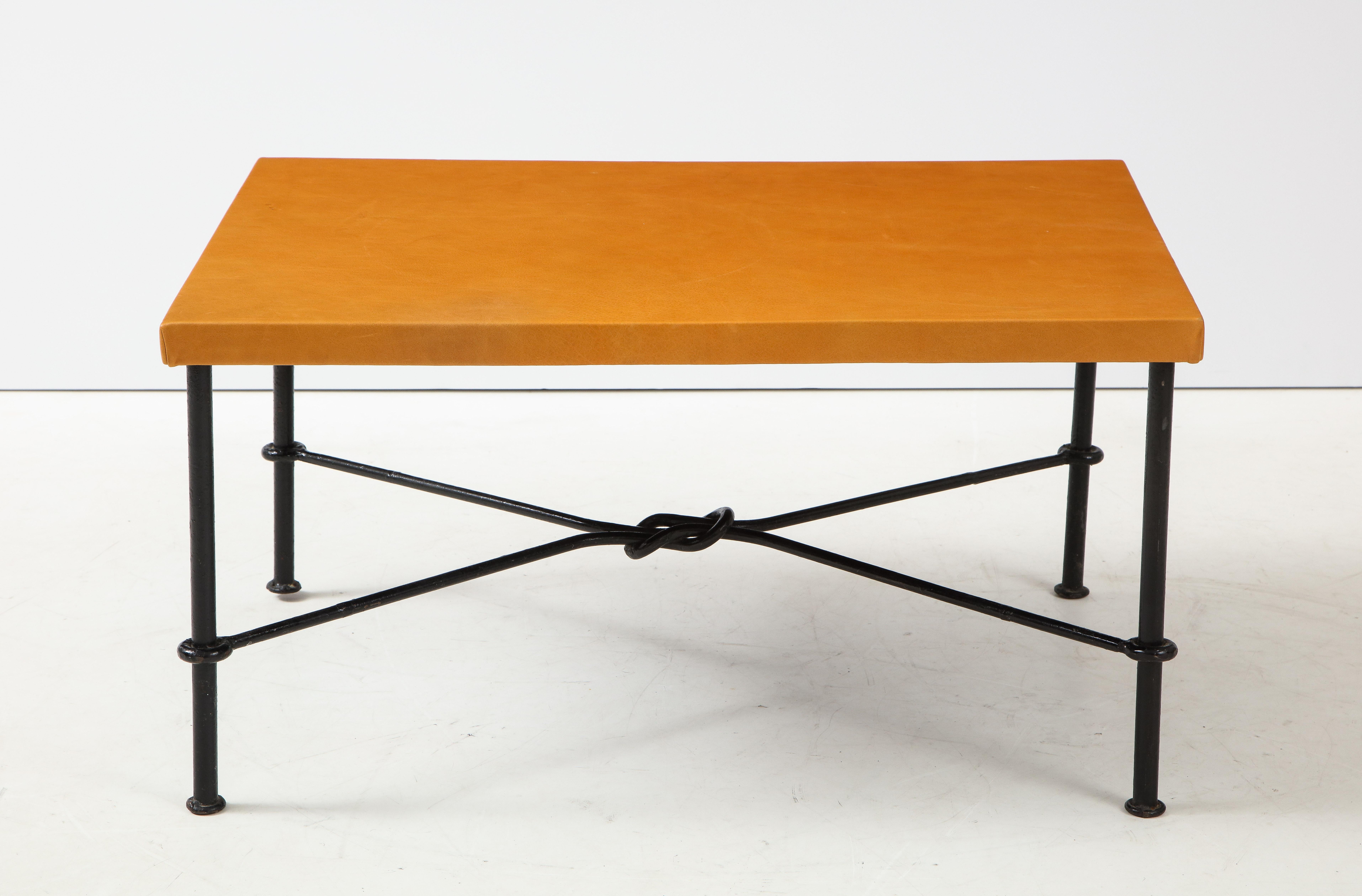 Modernist lacquered wrought iron and leather top side table; leather top is new
interesting iron knot metal work.