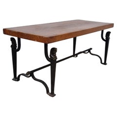 Wrought iron living room table decorated with horse heads, solid oak top circa 1