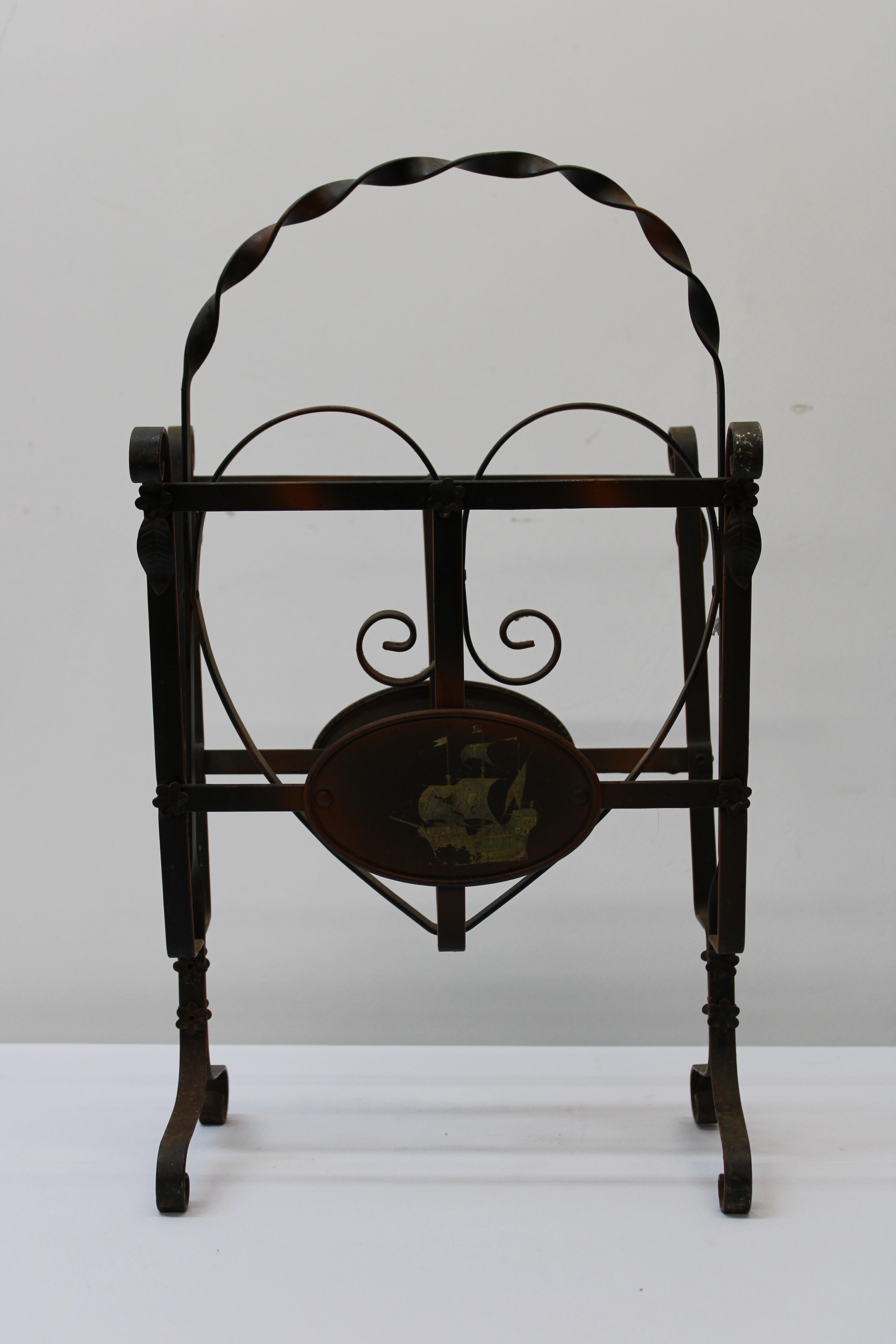 C. 20th century

1940's style wrought iron magazine stand w/ heart design & hand painted clipper ships.