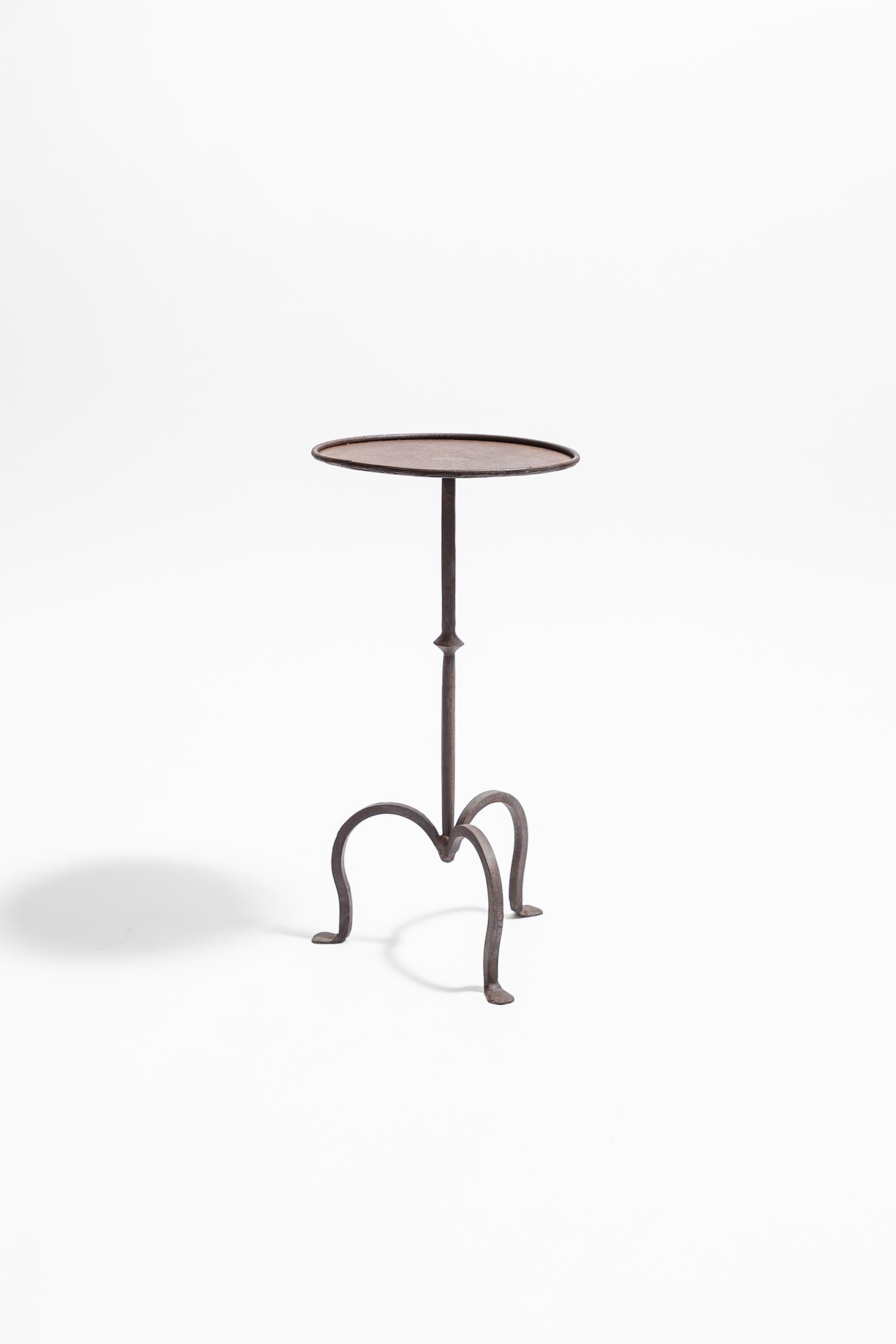 A wrought iron martini table, hand made in England to a 1940s original design. 500

Shown here finished with a natural bronze patina. Available in bronze or black finishes.

Large: 31 cm diameter top, 56 high 

From stock or made to order on a c. 4