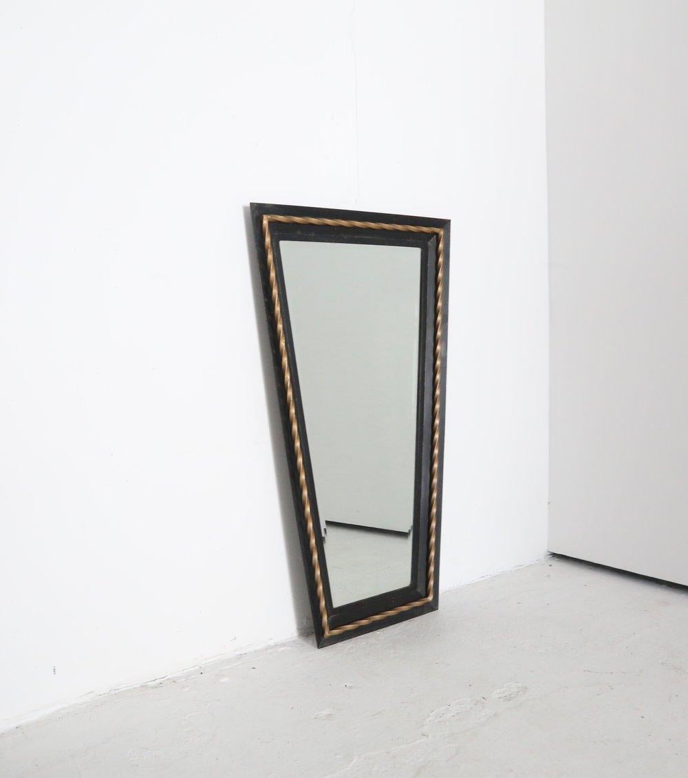 Chic and decorative tapered mirror.

A wrought iron tray frame with twisted gilt border detail.

Fixing points to the back.

Similar to early work by Mathieu Mategot.

France 1940s

Shipping included in the sale price