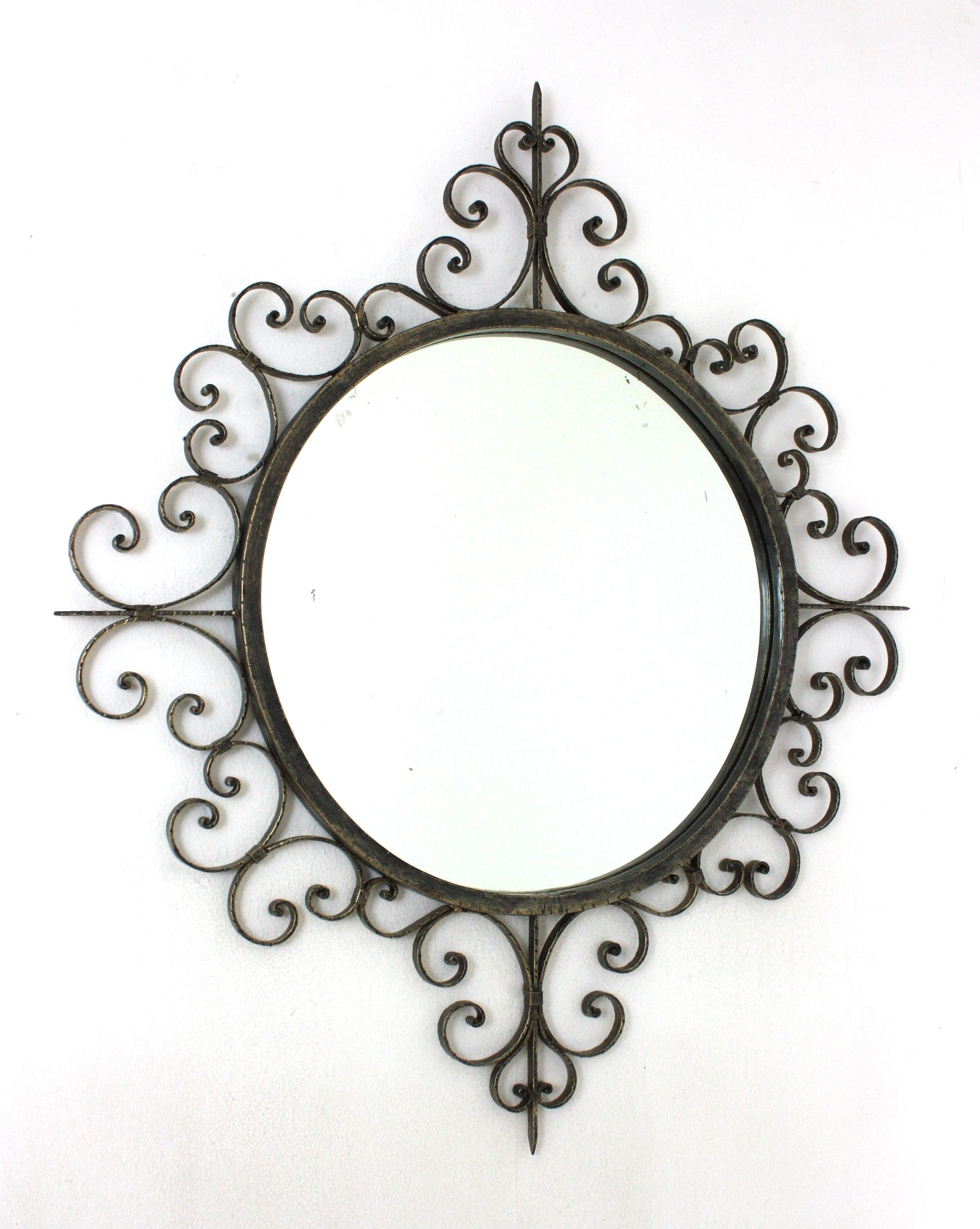 Large Scrollwork Silvered Wall Mirror, Hand Forged Iron, Spain, 1940s
Eye-catching ornamented scrolled wrought iron mirror with Spanish Colonial taste. Patinated in silver color.
This handcrafted mirror was manufactured in Spain at the Mid-Century