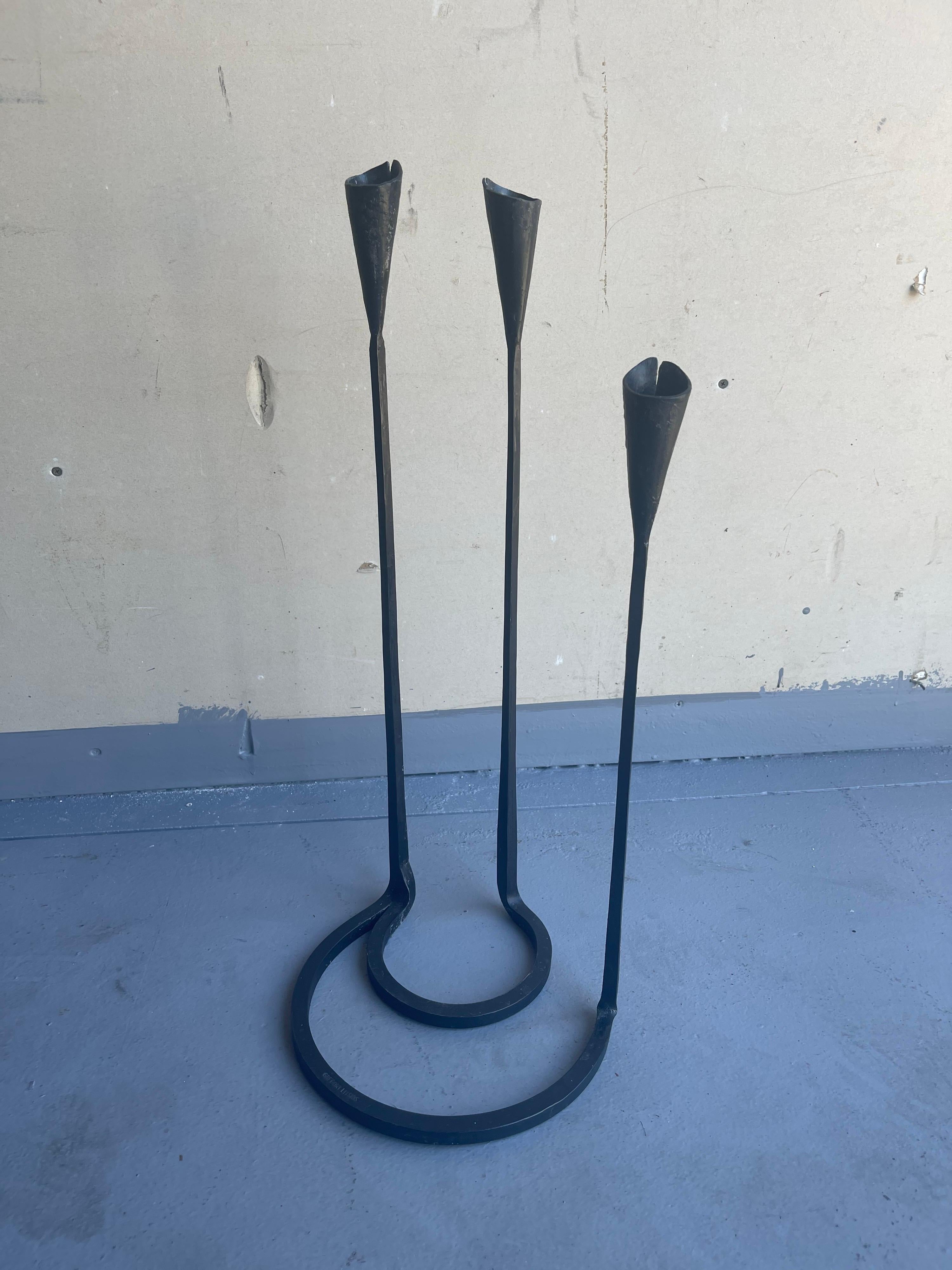Rare wrought iron modernist triple candleholder by Gregory Litsios, circa 1970s. The piece is in very good vintage condition and measures 9.5