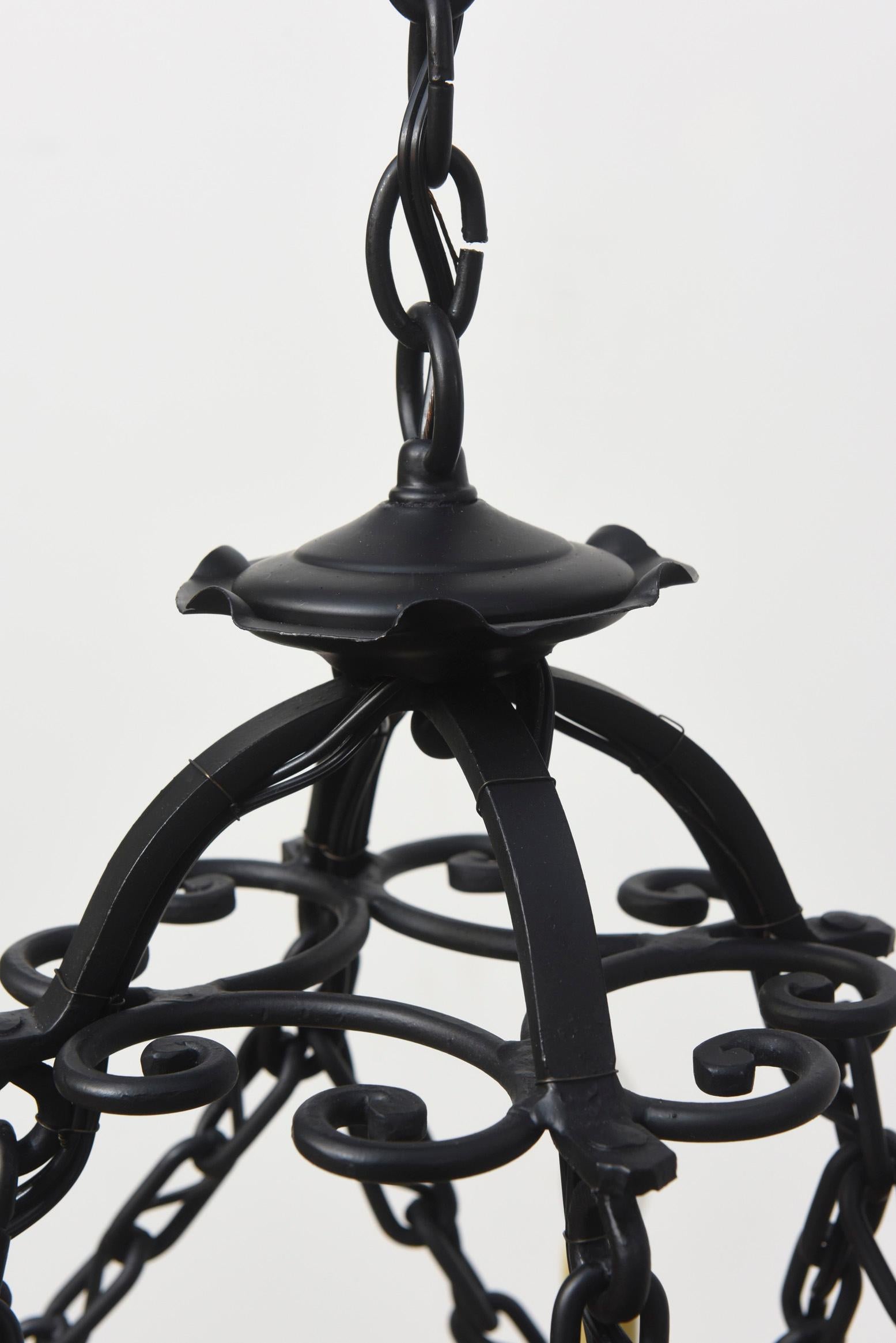 Wrought iron chandelier, ideal for an oval or rectangular dining table, a rustic open living room, or over a kitchen island. 8 lights. Completely restored and repainted. Rewired and ready to hang. Can be lengthened, or potentially be shortened to