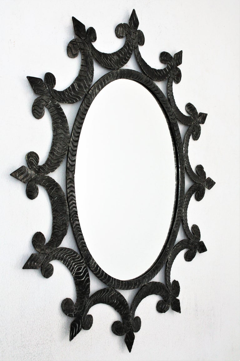 Wrought Iron Oval Sunburst Mirror with Scroll Details and Brutalist