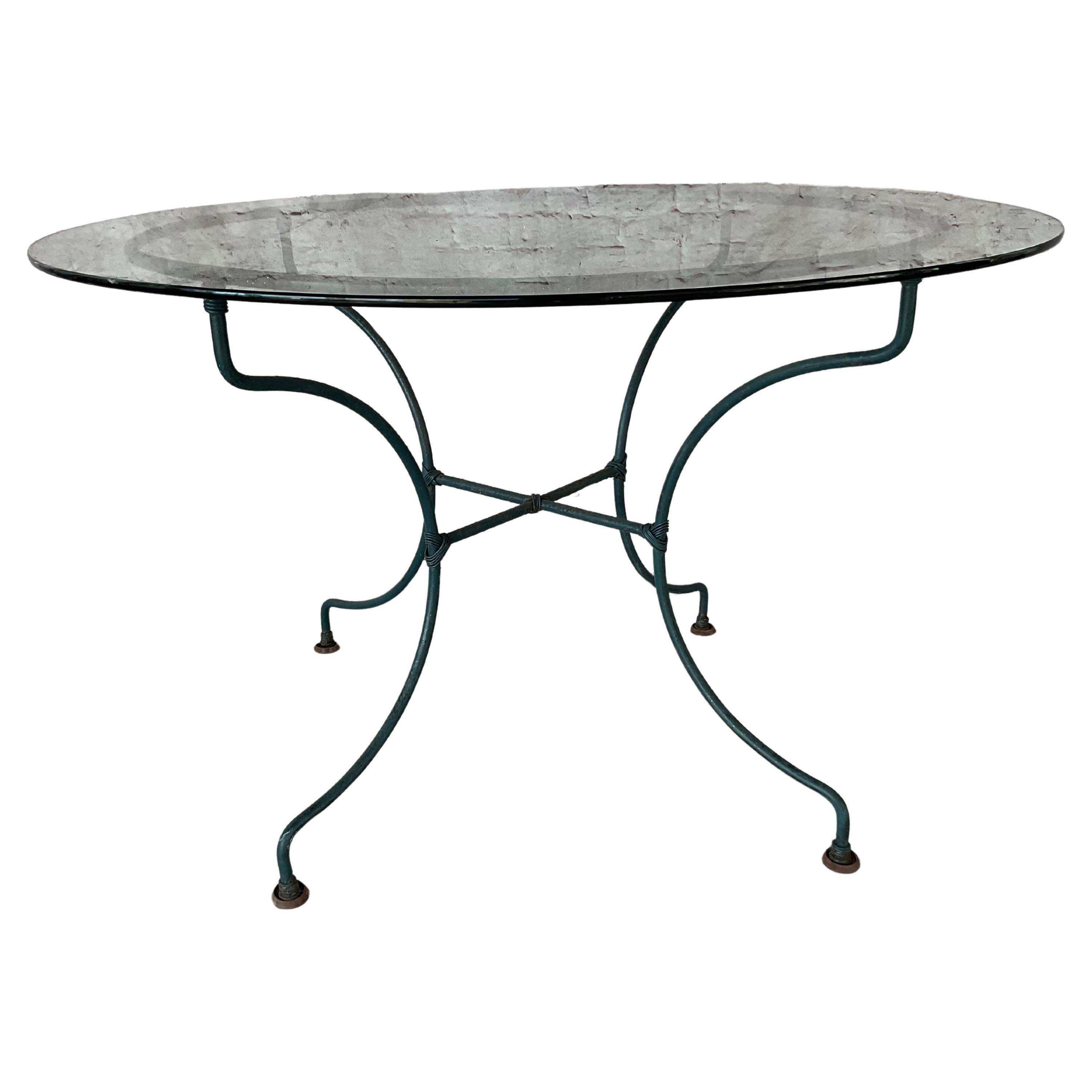 Mid-Century Wrought Iron Patio Table and Four Chairs in the style of Salterini. 48