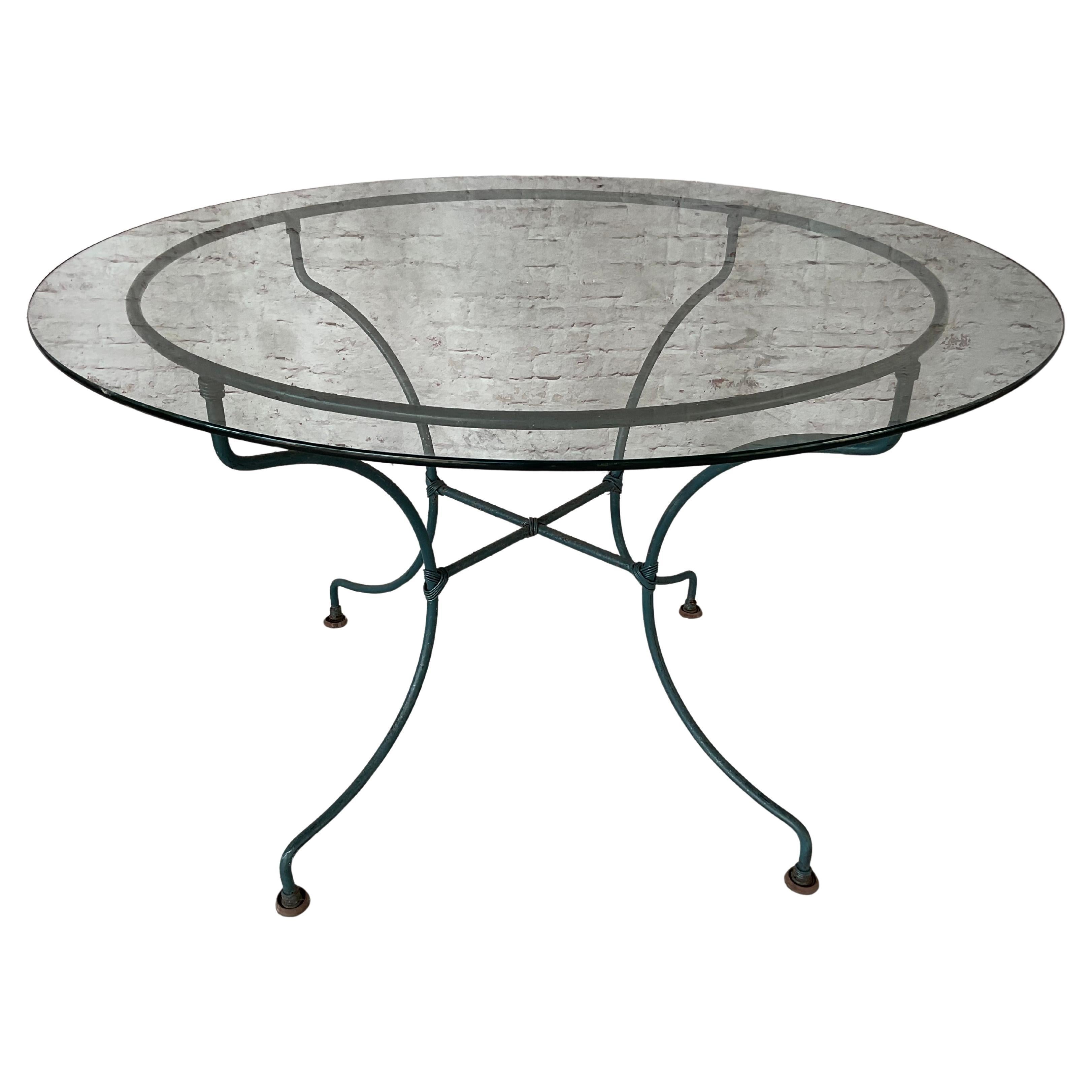 American Wrought Iron Patio Table and Four Chairs, A Five Piece Set For Sale