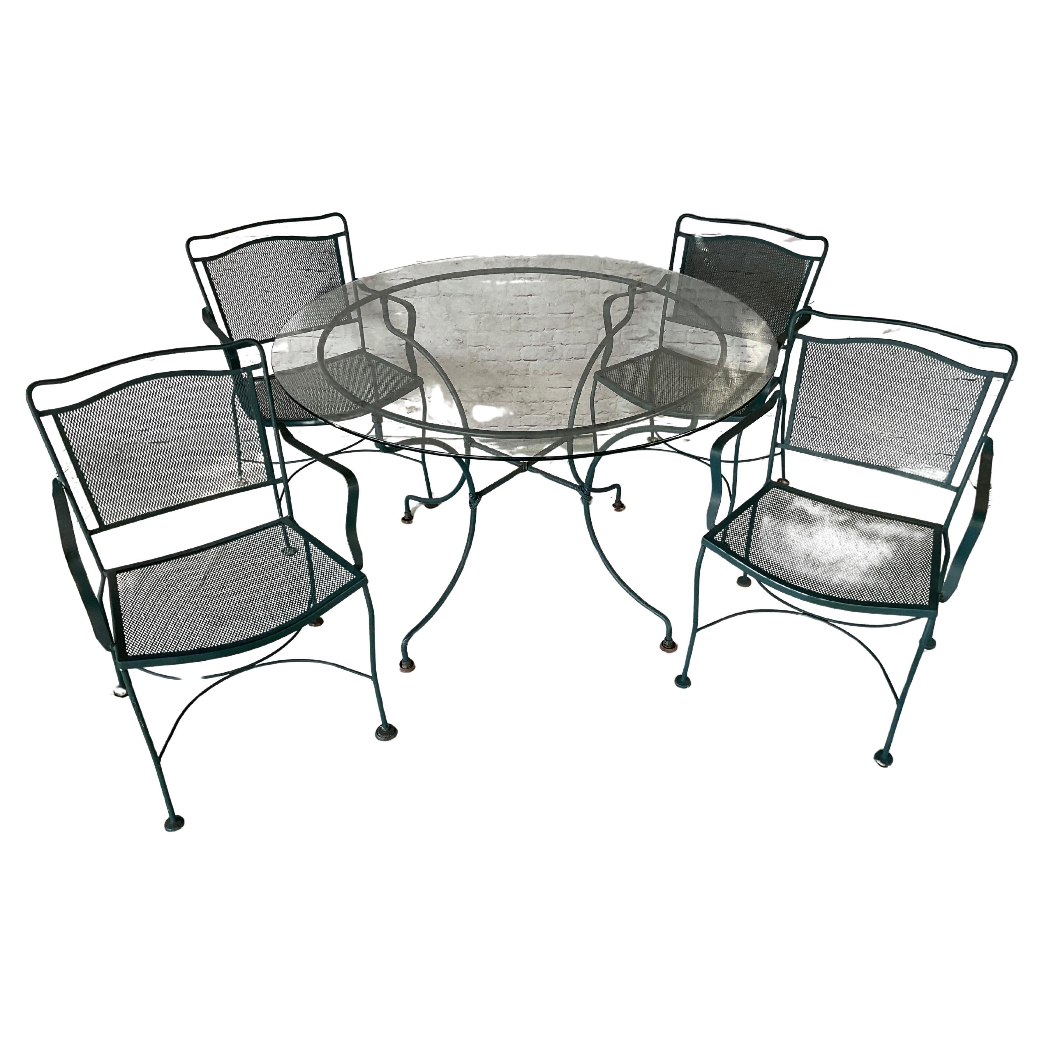 Wrought Iron Patio Table and Four Chairs, A Five Piece Set In Good Condition For Sale In Bradenton, FL
