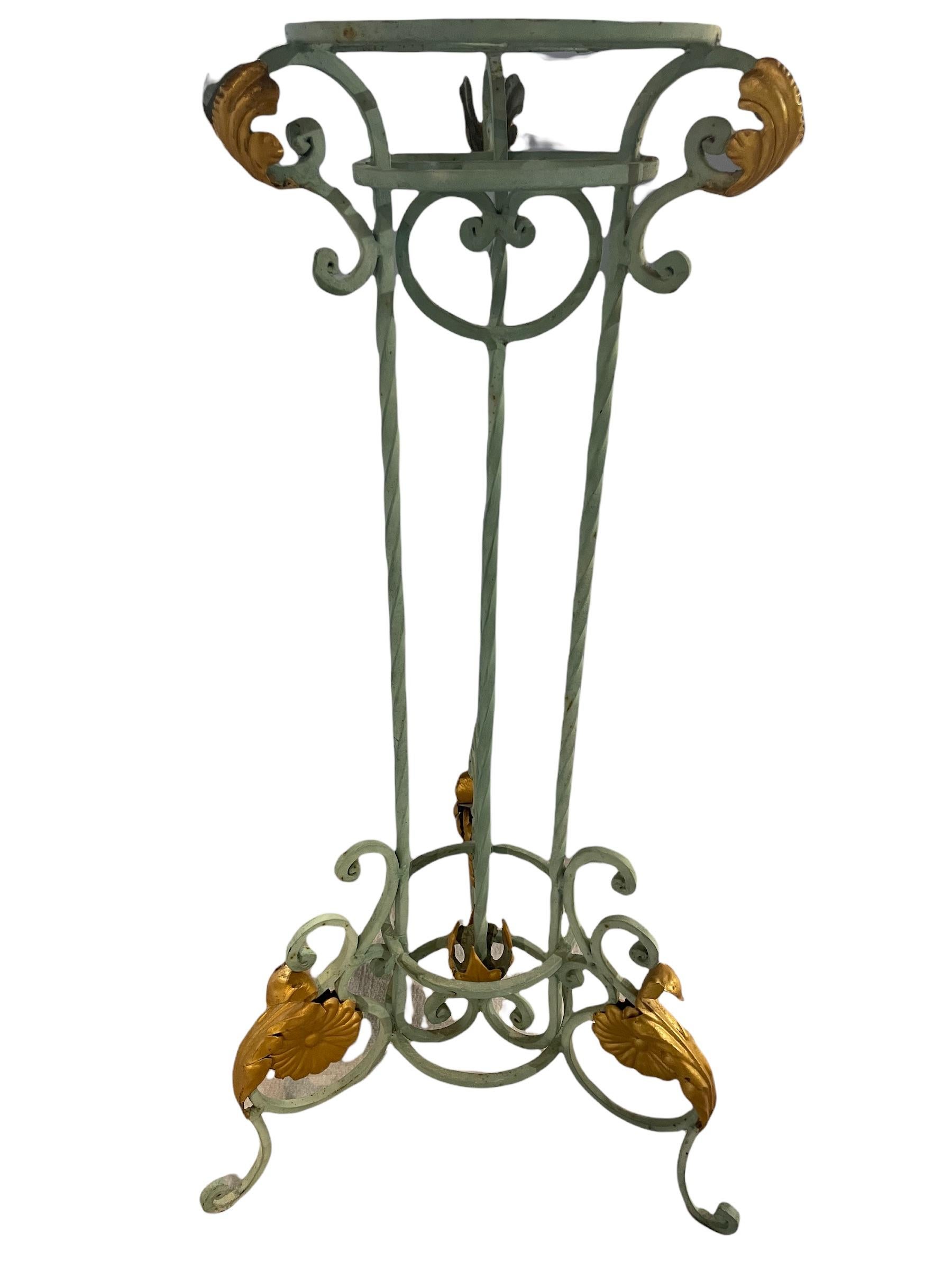 Spectacular french wrought iron plant stand featuring a rich gold acanthus metal ?nish. They will bring elegance and nobility to a quality residence.