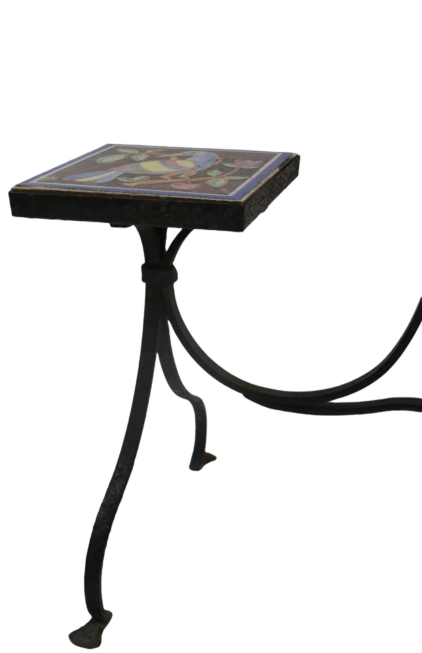 Charming and well executed three branch wrought iron plant stand, with original ceramic tile insert surfaces. The base is hand wrought iron, the tiles are attributed to ICS ( Industrial Ceramica Salernitana ) possibly by noted Italian ceramicist