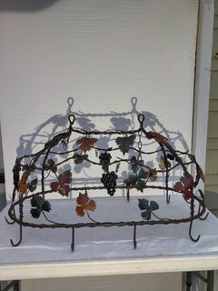 Wrought iron pot rack with leaves and grapes