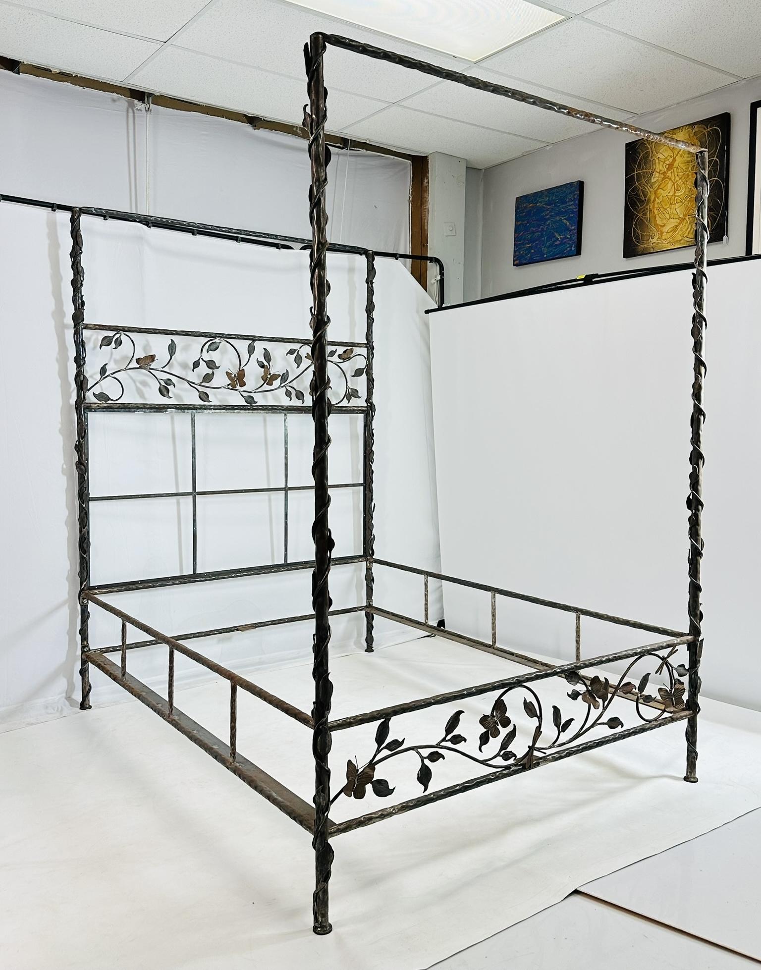 Stunning wrought iron Queen size bed designed and manufactured in Los Angeles California by Paul Ferrante.

The bed is very whimsical design, the headboard and footboard feature a foliage with Butterflies and fireflies.

The headboard has a an area