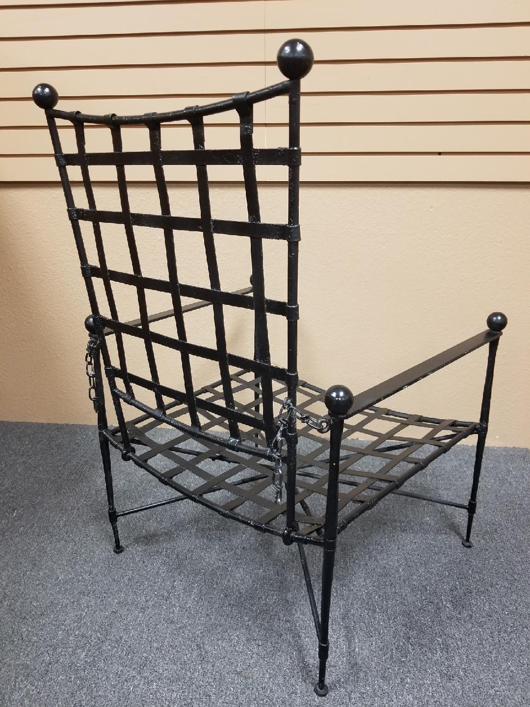 A very nice midcentury wrought iron reclining armchair by Mario Papperzini for John Salterini, circa 1950s. The piece is painted black and has an adjustable back. Arm height is 21