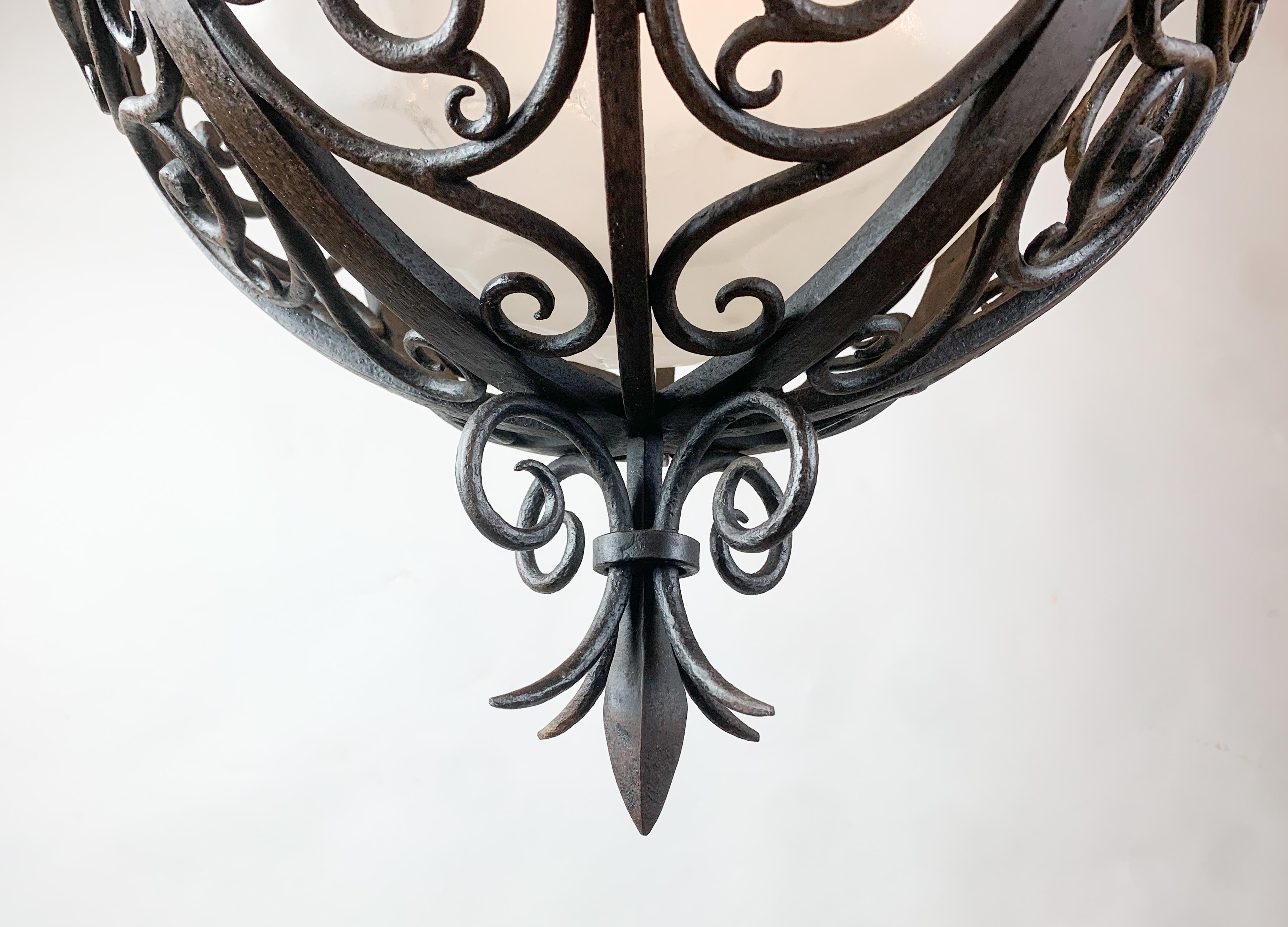 Mid-20th Century Wrought Iron Round Suspension with Interior Glass Sphere, C.1930 For Sale