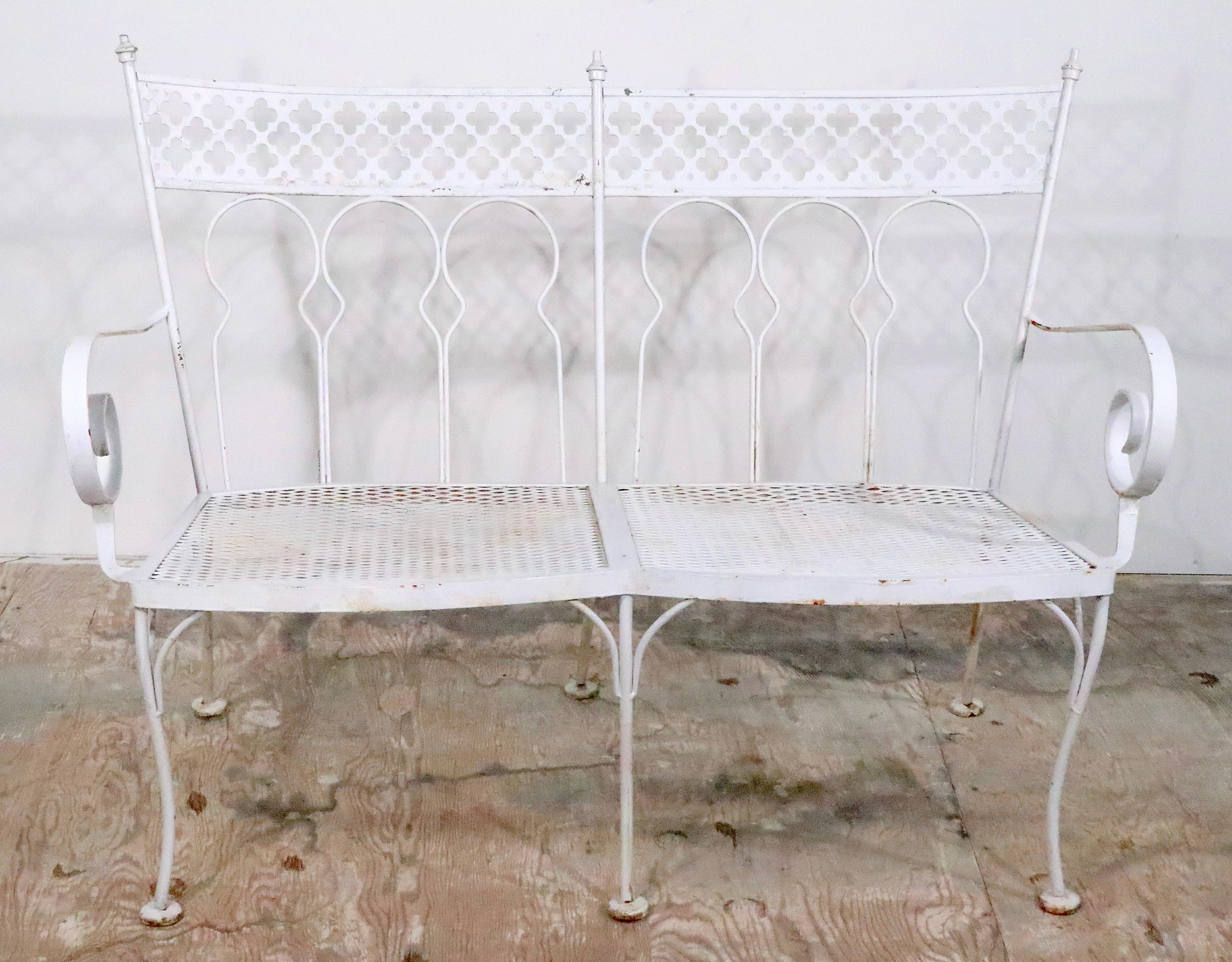 Rare Taj Mahal pattern garden, patio, poolside bench by Salterini. Constructed of wrought iron, cut steel, and metal mesh. The bench is in very good, vintage estate  condition, clean and ready to use. Currently in later, but not new, white paint