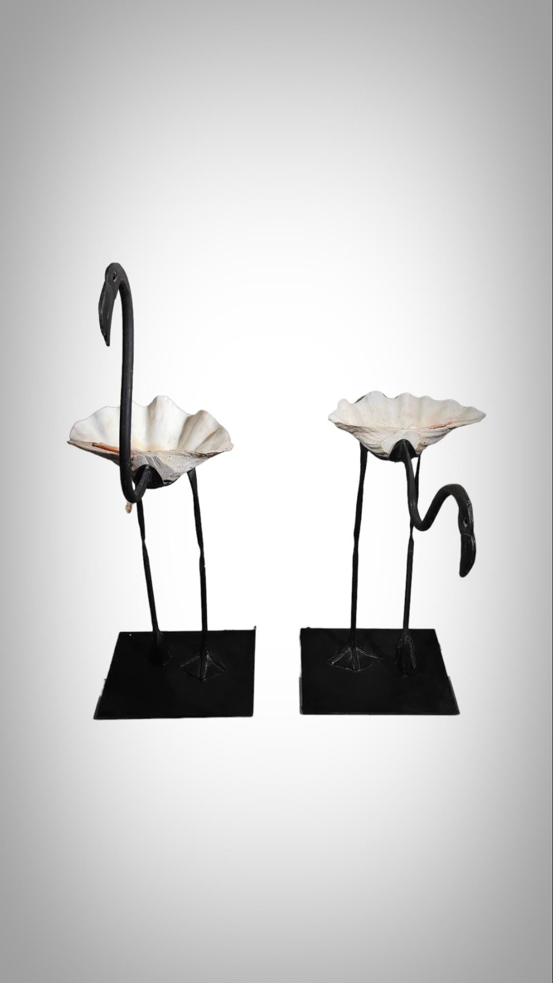 Wrought Iron Sculptures Of Life Size Flamingos
DECORATIVE SCULPTURES FROM THE 1950s IN THE SHAPE OF 2 FLAMINGOS. HOT WORKED WROUGHT IRON AND GIANT SHELL BODY. THE EYES ARE IN TRANSLUCENT VIOLET FACETED CRYSTAL. VERY DECORATIVE AND IN OVERALL GOOD