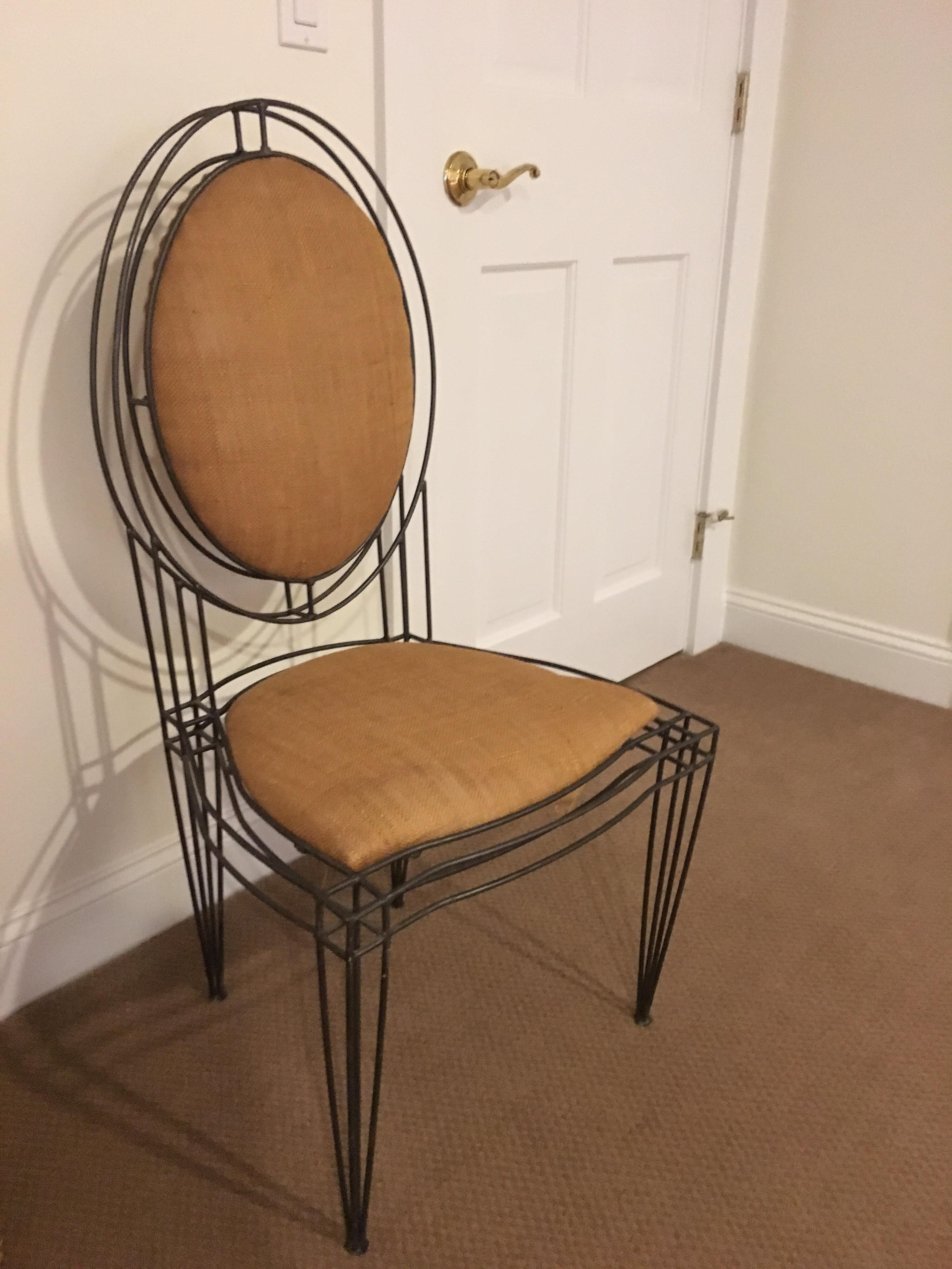 Wrought Iron frame with burlap upholstery.