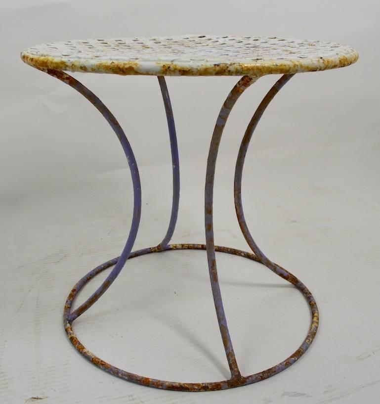 Stylish wrought iron stand having weave pattern top, with waisted form base. This example is currently in old paint finish, usable as is, or we can provide custom powder coat finish if you prefer a more polished look.