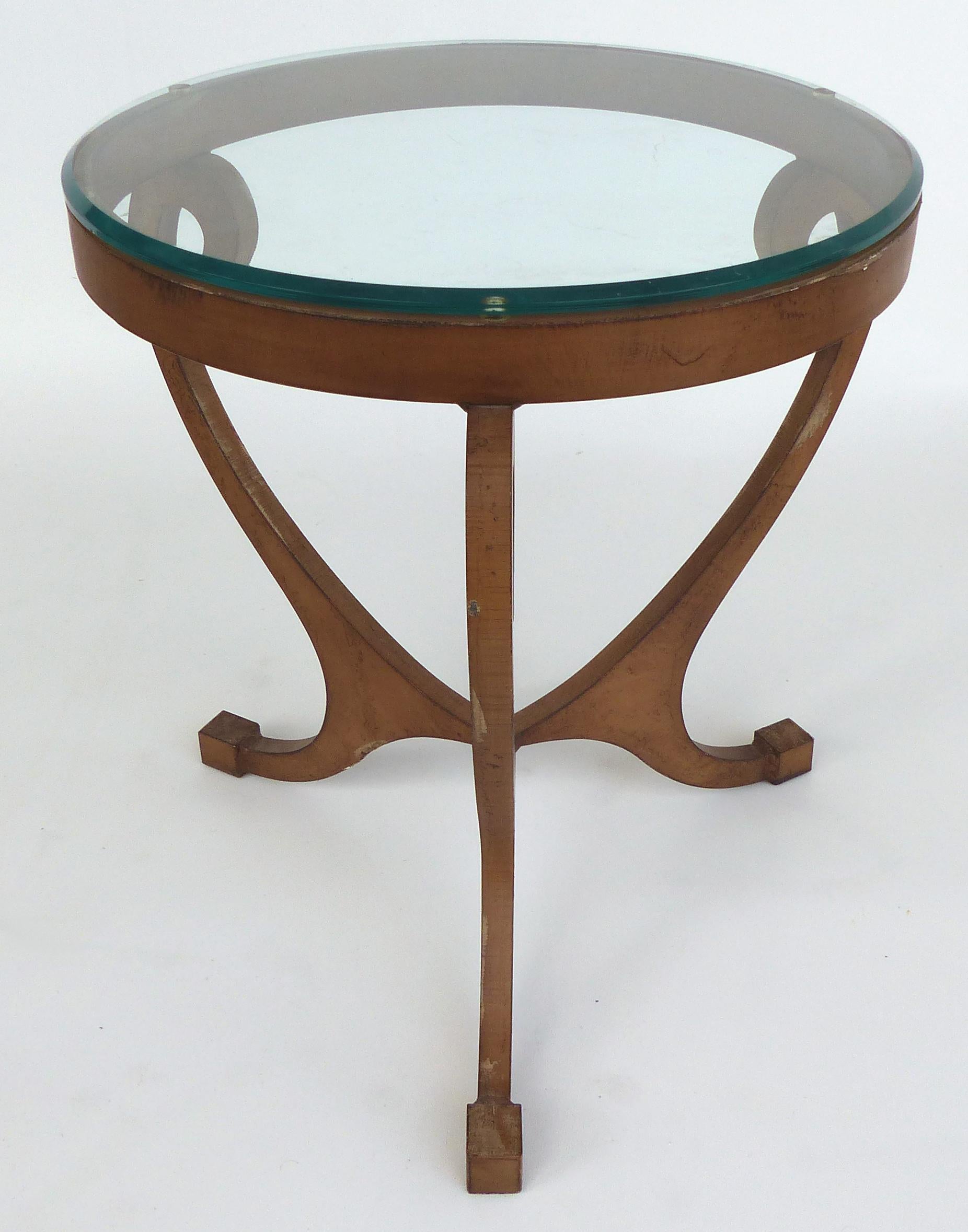 Wrought Iron Side Table with Glass Top

Offered for sale is a substantial three-leg wrought iron side table with handcut curved legs and support details. The table is cut from extremely heavy stock and fitted with a glass top that has a blunt edge.
