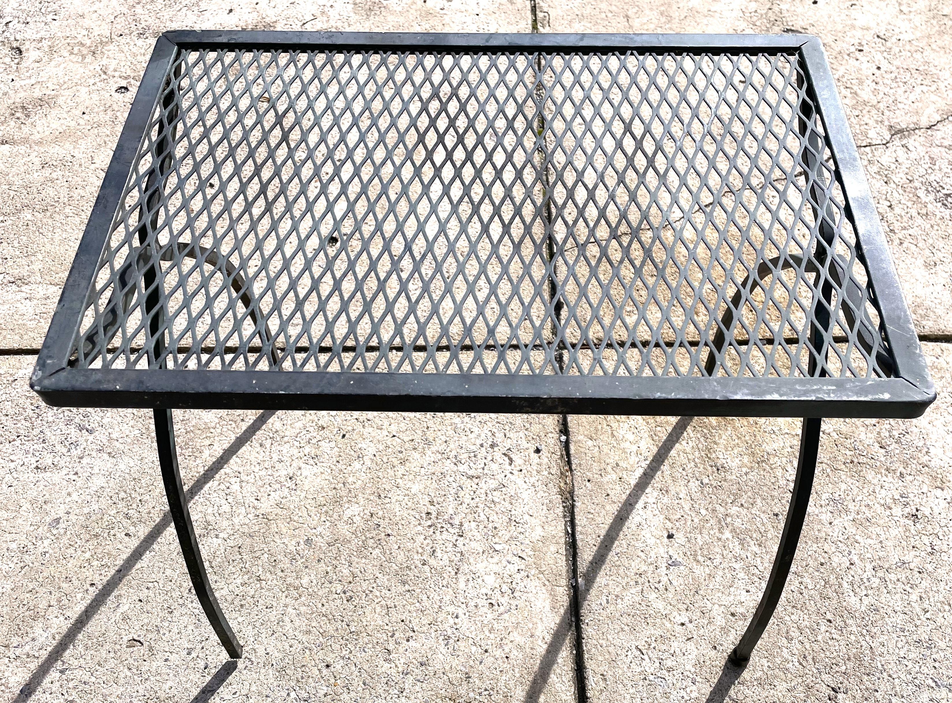 This is a great looking and very useable small side table by itself, but I think it was originally part of a stacking set. The table is 18 3/8 inches wide, 12 3/8 inches deep and 17 inches tall and is a wonderful steel gray black that looks like it