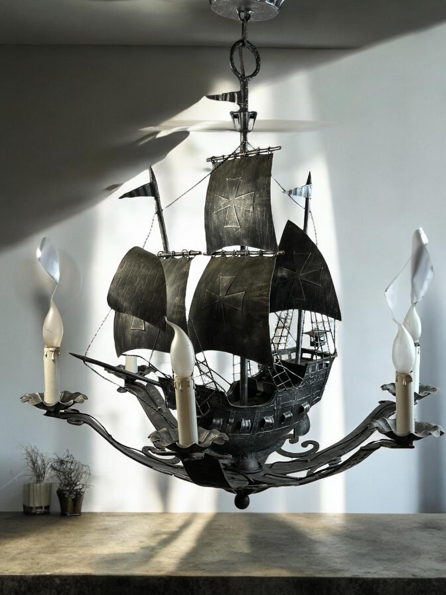 Beautiful impressive silver color wrought iron six-light chandelier represents a beautiful Spanish galleon with three masts and sailing ship details such as sails, ropes, anchor, flags, and lantern.  This outstanding chandelier is a real eye-catcher