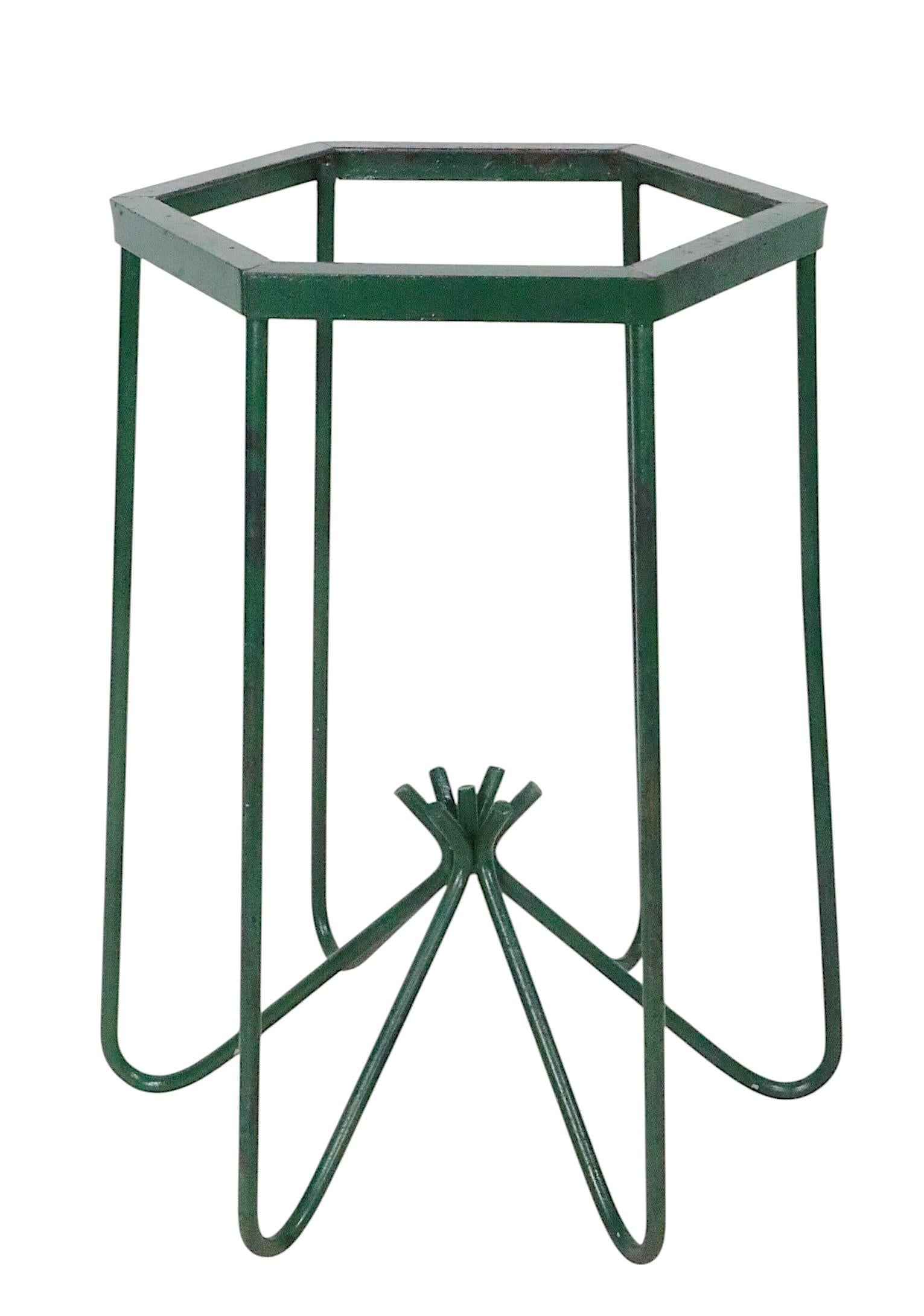 Wrought iron table base having a hexagonal top, with hairpin legs that gather in the center. Reminiscent of Jean Royere, probably American made circa 1950's. The table is missing it's original top, and is in later, but not new, green paint finish. 