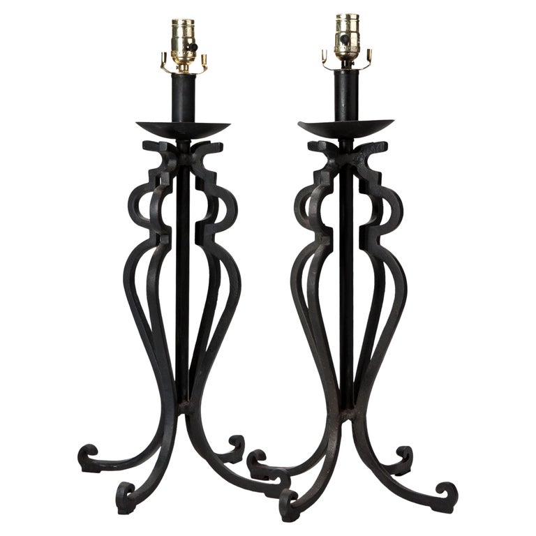 Handsome heavy hand wrought iron with square iron creating a stunning silhouette. Shades are available for an additional charge. inquire within.