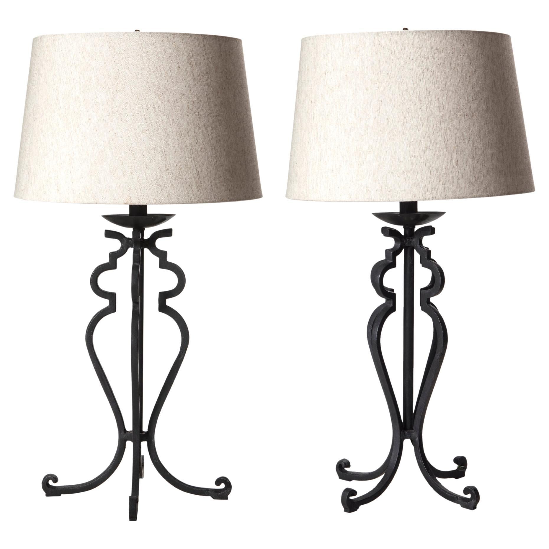 Handsome heavy hand wrought iron lamps constructed in square iron creating a stunning geometric silhouette. 