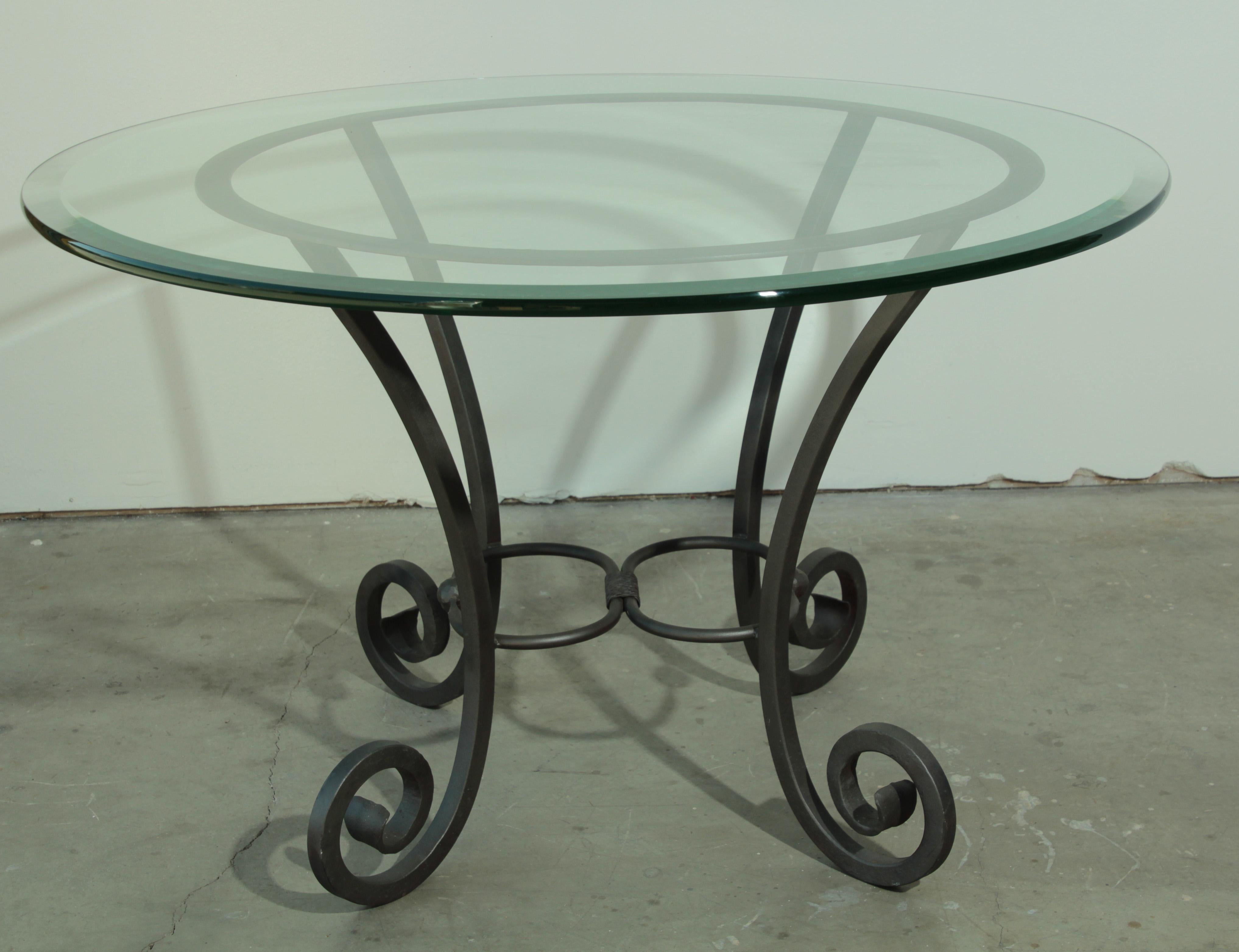 Hand forged Spanish iron table base with glass top.
Curved legs and two unique turned iron with two balls in the center.
Wrought iron dining table pedestal with curved legs.
Could be use indoor or outdoor.
Spanish Moorish style.
Dimensions:
Diameter