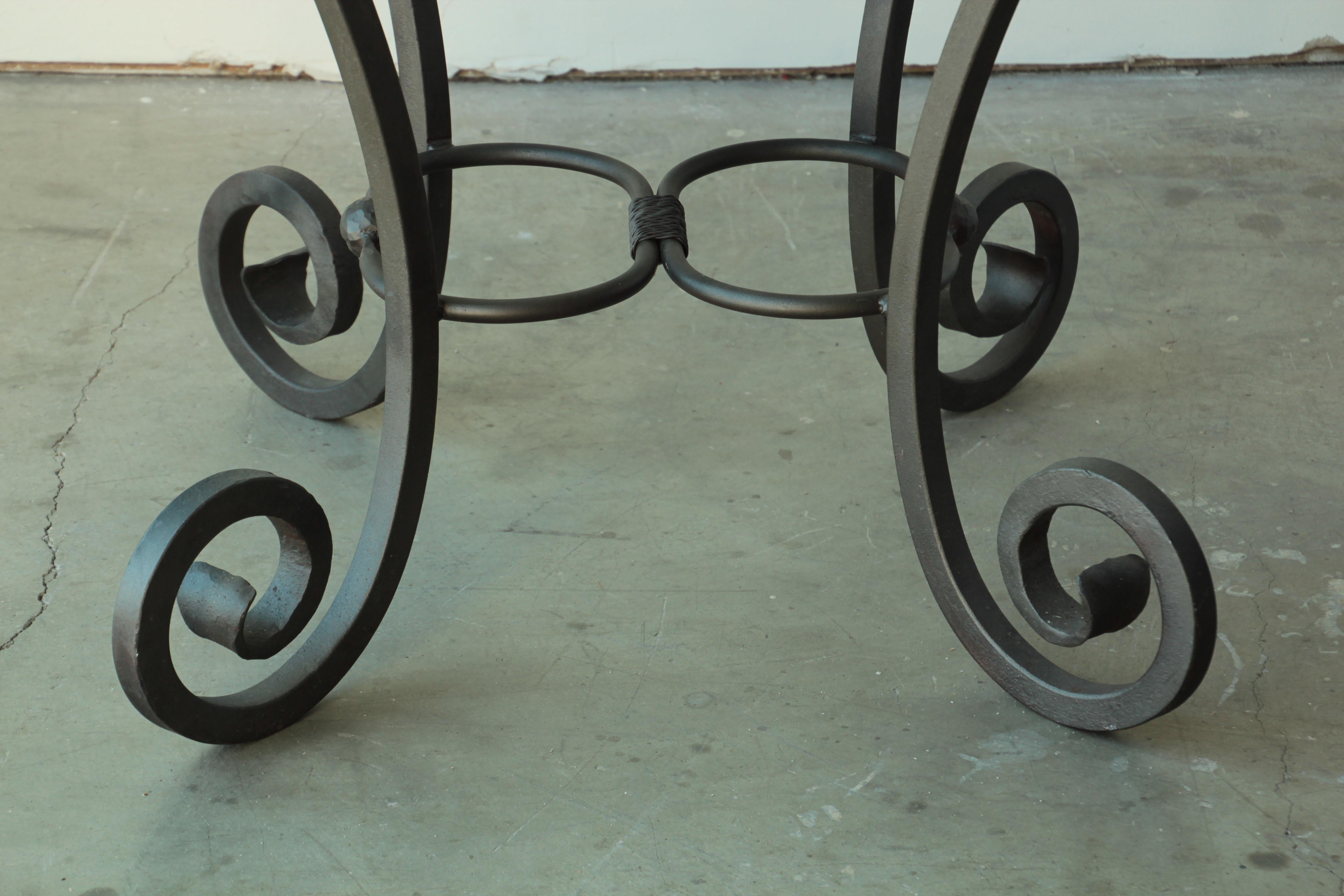 vintage wrought iron table with glass top