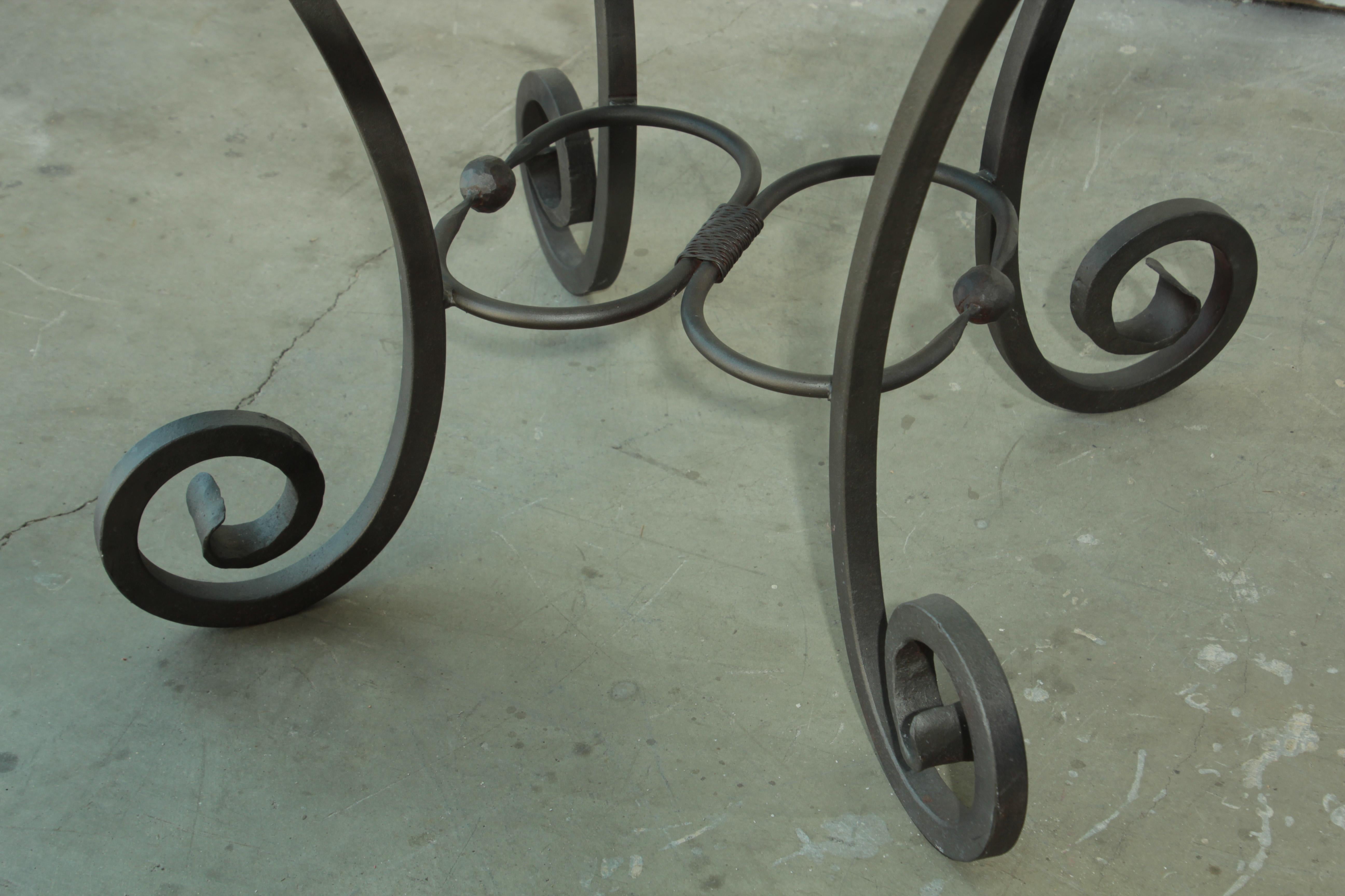 vintage wrought iron table with glass top