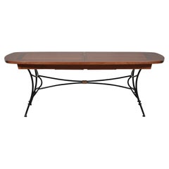 Wrought-iron table with solid cherry top - integrated extensions