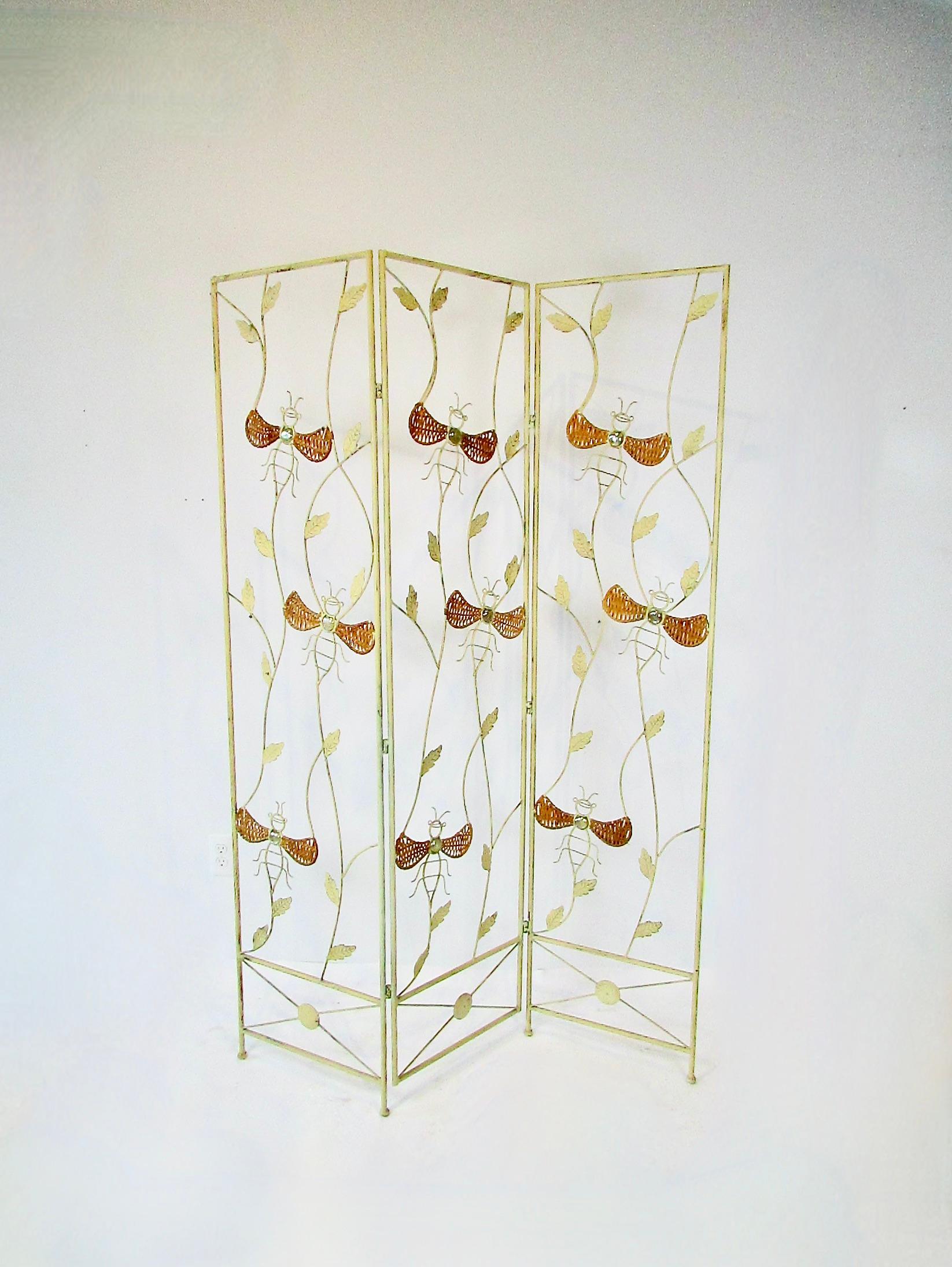 Unique whimsical and organic in design wrought iron  three panel screen . Lacquered steel with bumblebee / insect decoration . Wings of the bee are decorated in cane the body is glass .
Each panel measures 17